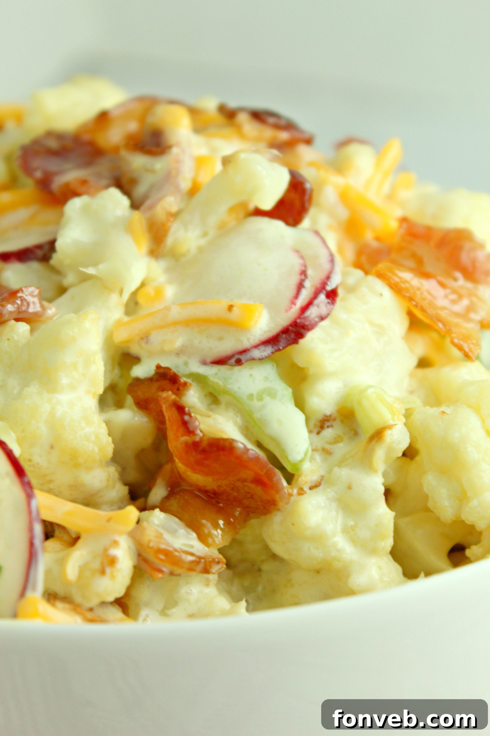 Ingredients for the creamy dressing being whisked in a bowl