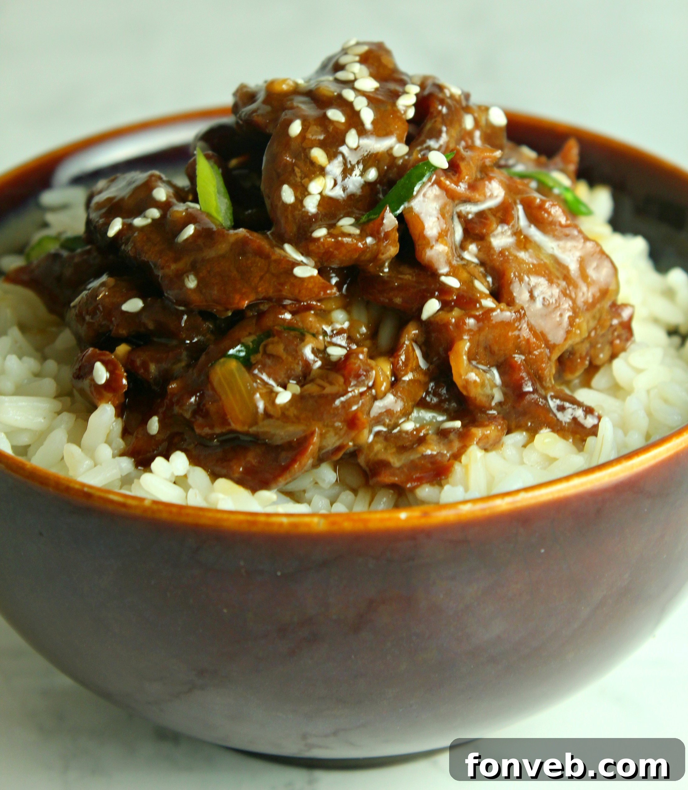 Slow Cooker Korean Beef in a bowl with chopsticks