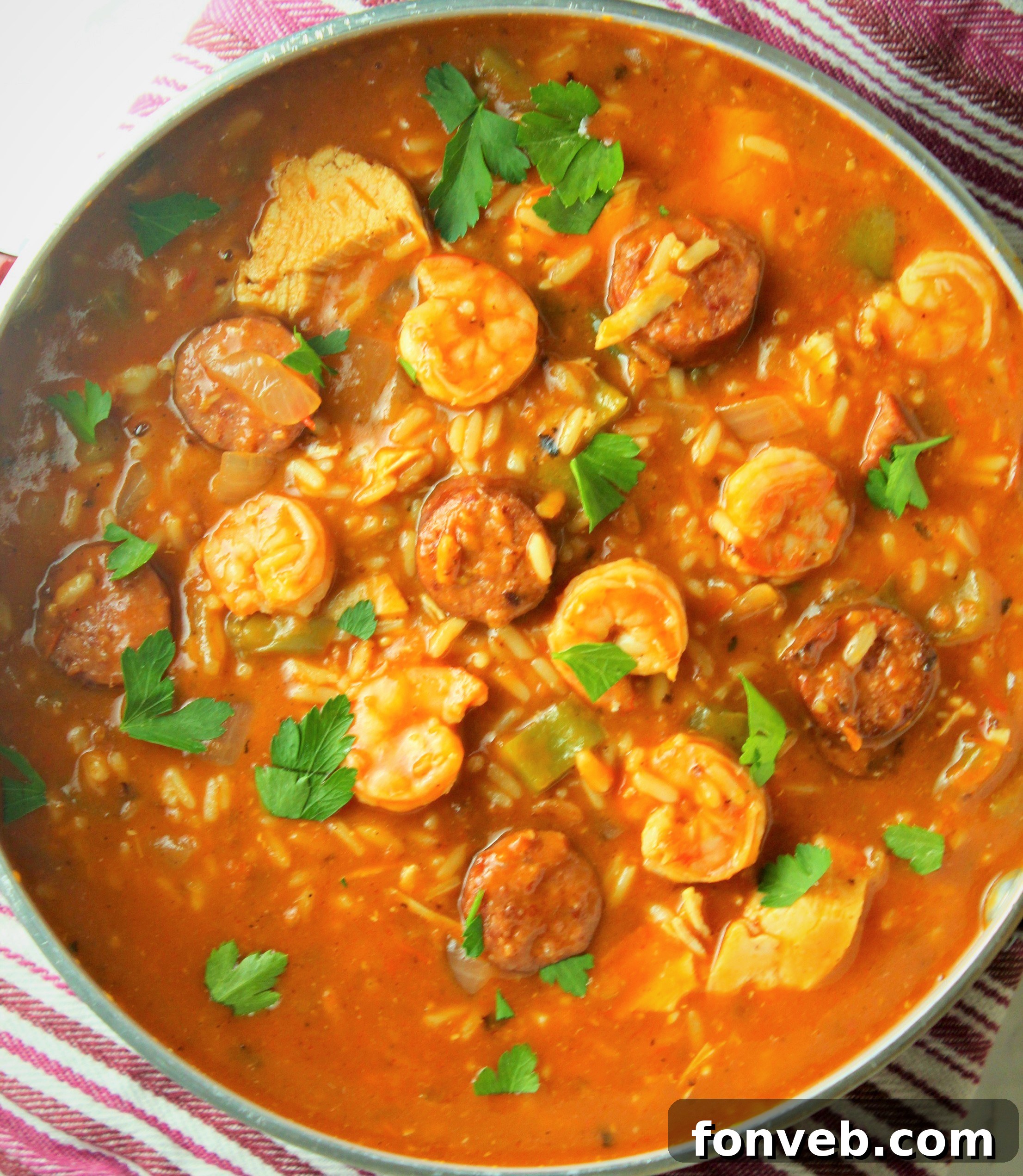 Spicy Cajun Jambalaya Soup 4 A top-down view of Jambalaya Soup in a rustic bowl, highlighting the texture and variety of ingredients, ready to be served.