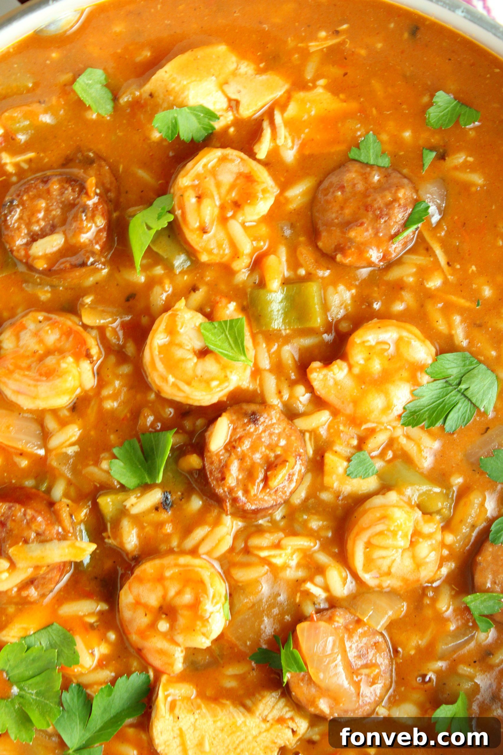 Spicy Cajun Jambalaya Soup 6 A large pot filled with simmering Jambalaya Soup, showcasing the array of ingredients and rich color.