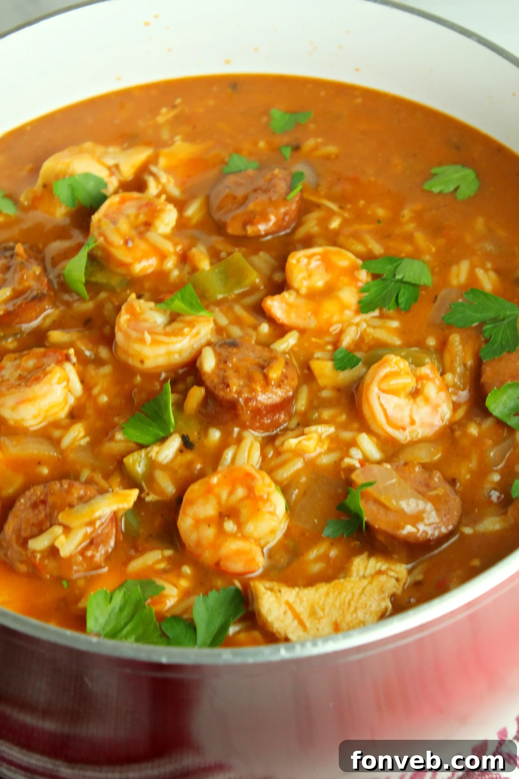 Spicy Cajun Jambalaya Soup 9 A close-up of fresh, raw shrimp and sliced smoked sausage, ready to be added to the Jambalaya Soup.
