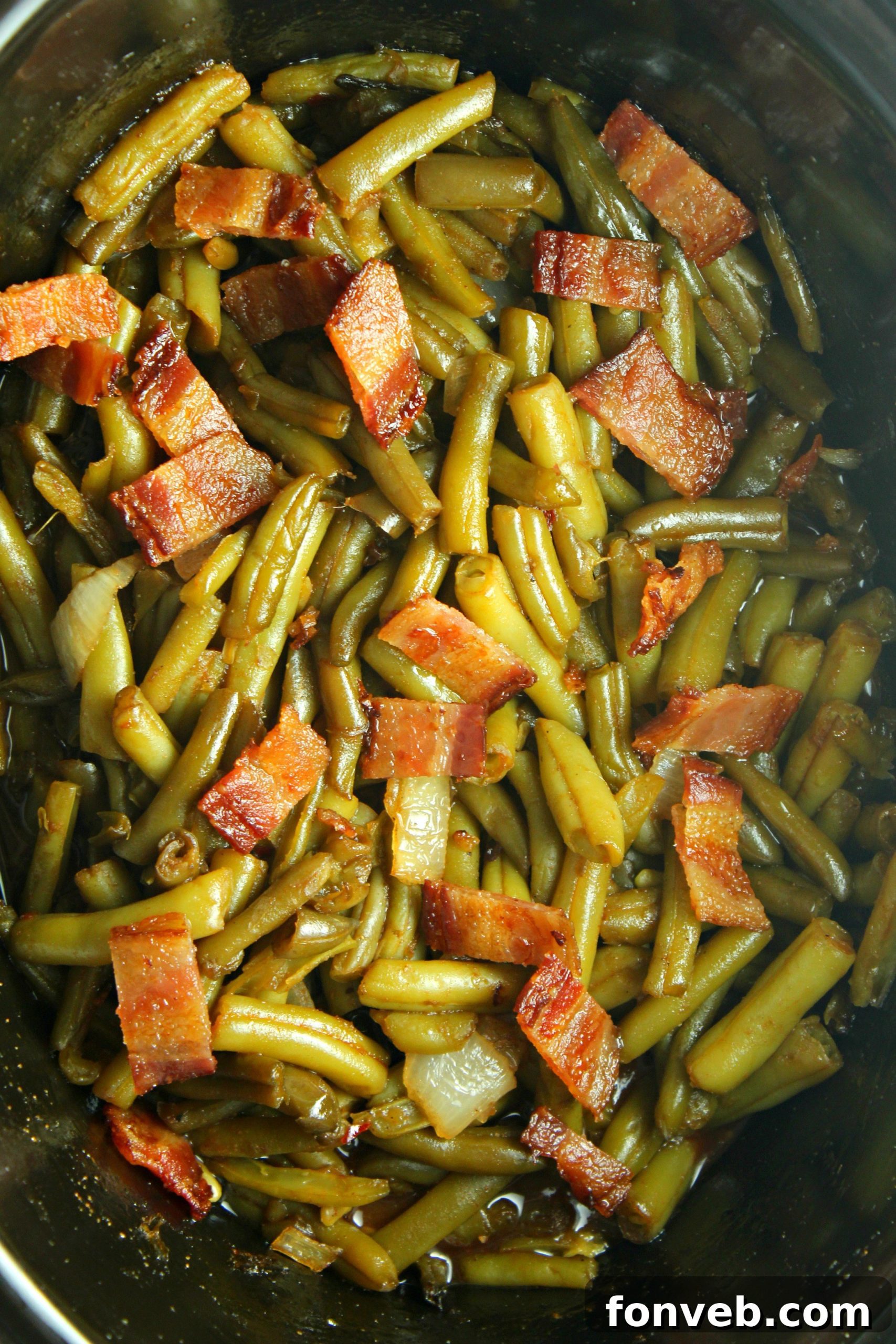 Another enticing close-up of the finished Slow Cooker Buttery Bacon Green Beans, emphasizing their tender texture and rich coating.