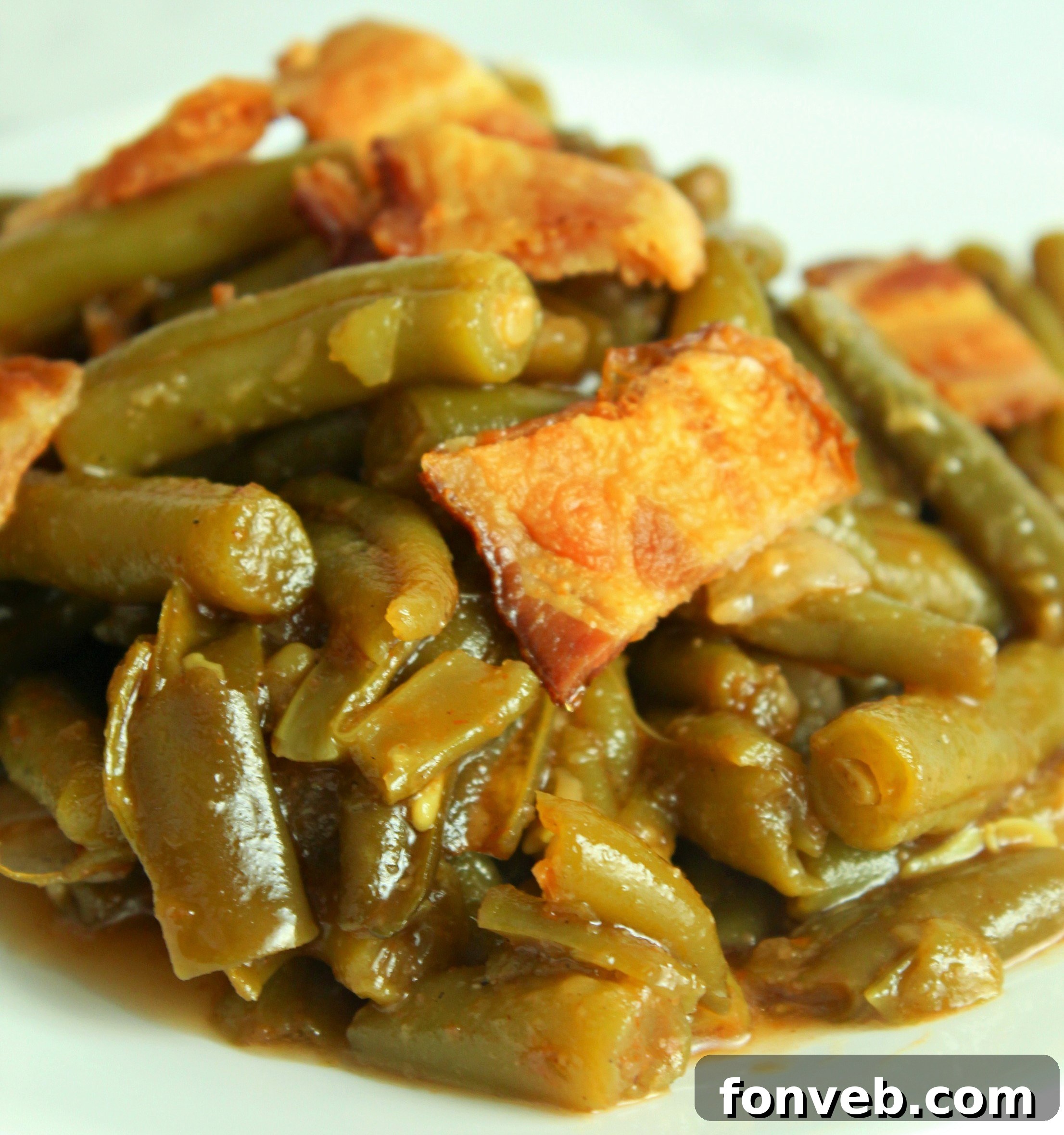 The final elegant presentation of the Slow Cooker Buttery Bacon Green Beans, ready to be served at a special occasion.