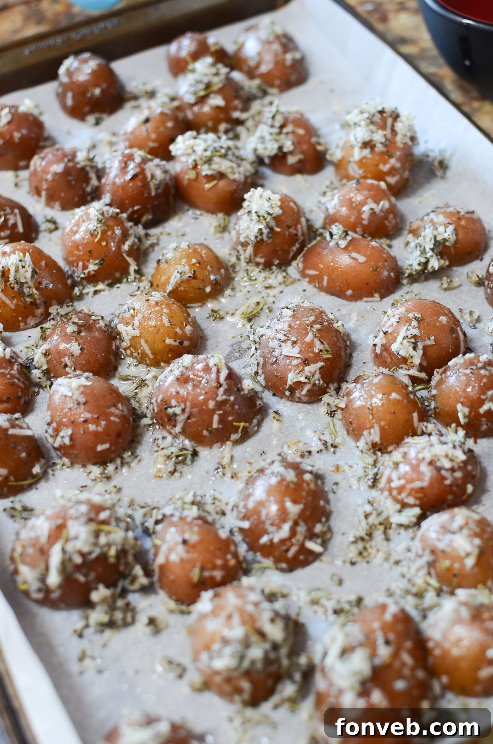 A serving of parmesan crusted roasted potatoes, showcasing their crispy edges and golden color
