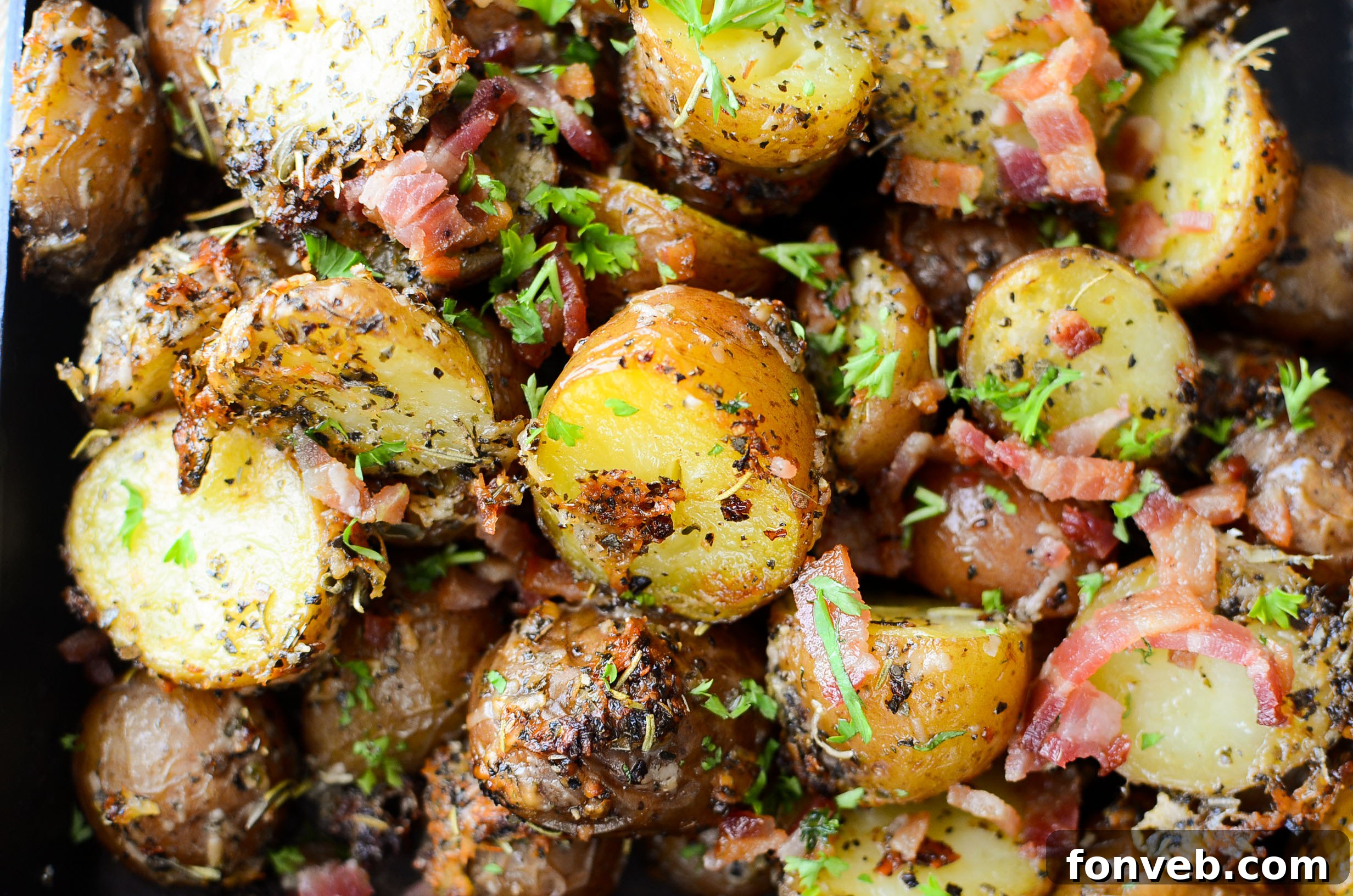 A generous pan of parmesan crusted roasted potatoes with bacon, just out of the oven