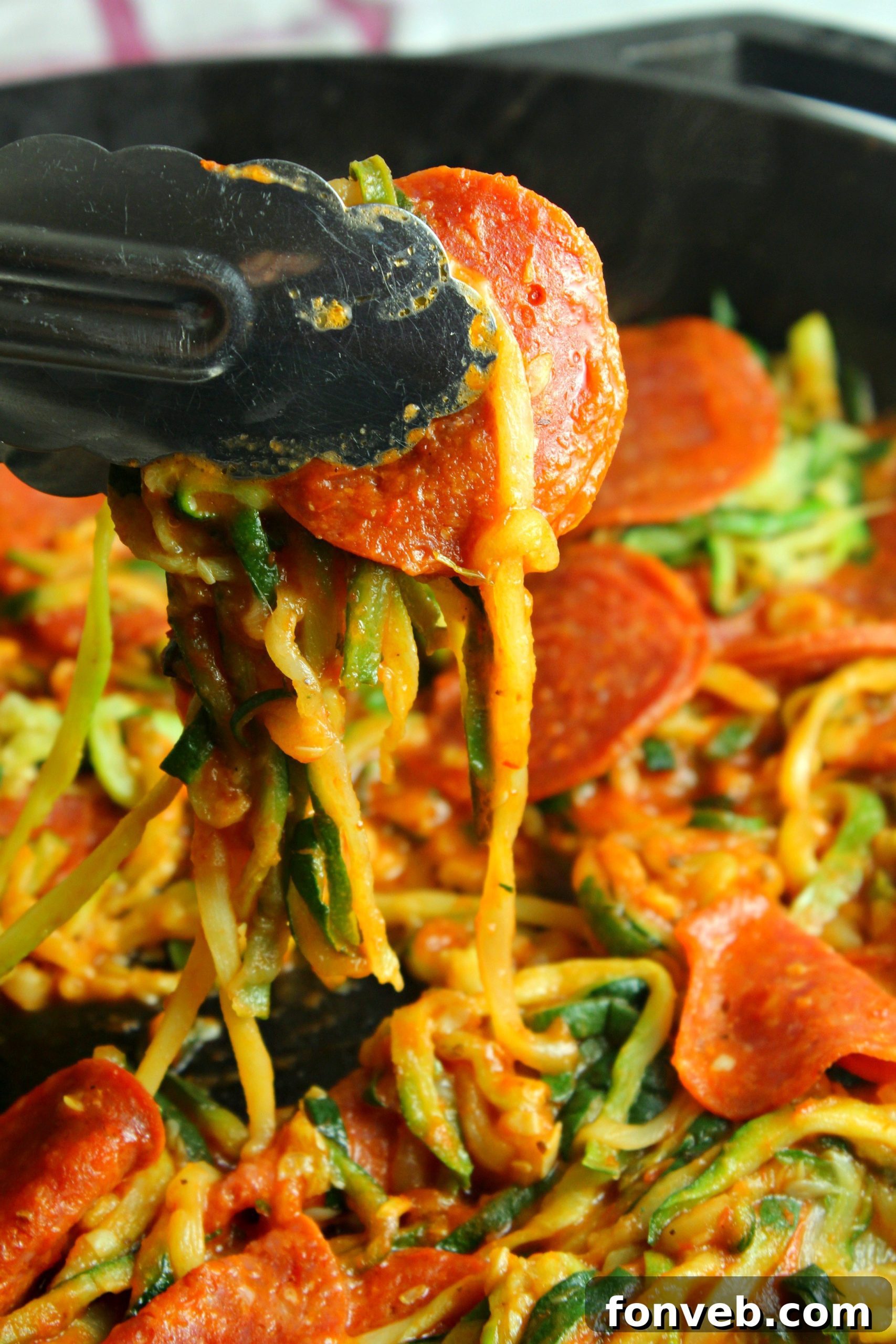 Close-up of a delightful plate of zucchini pasta with pizza toppings