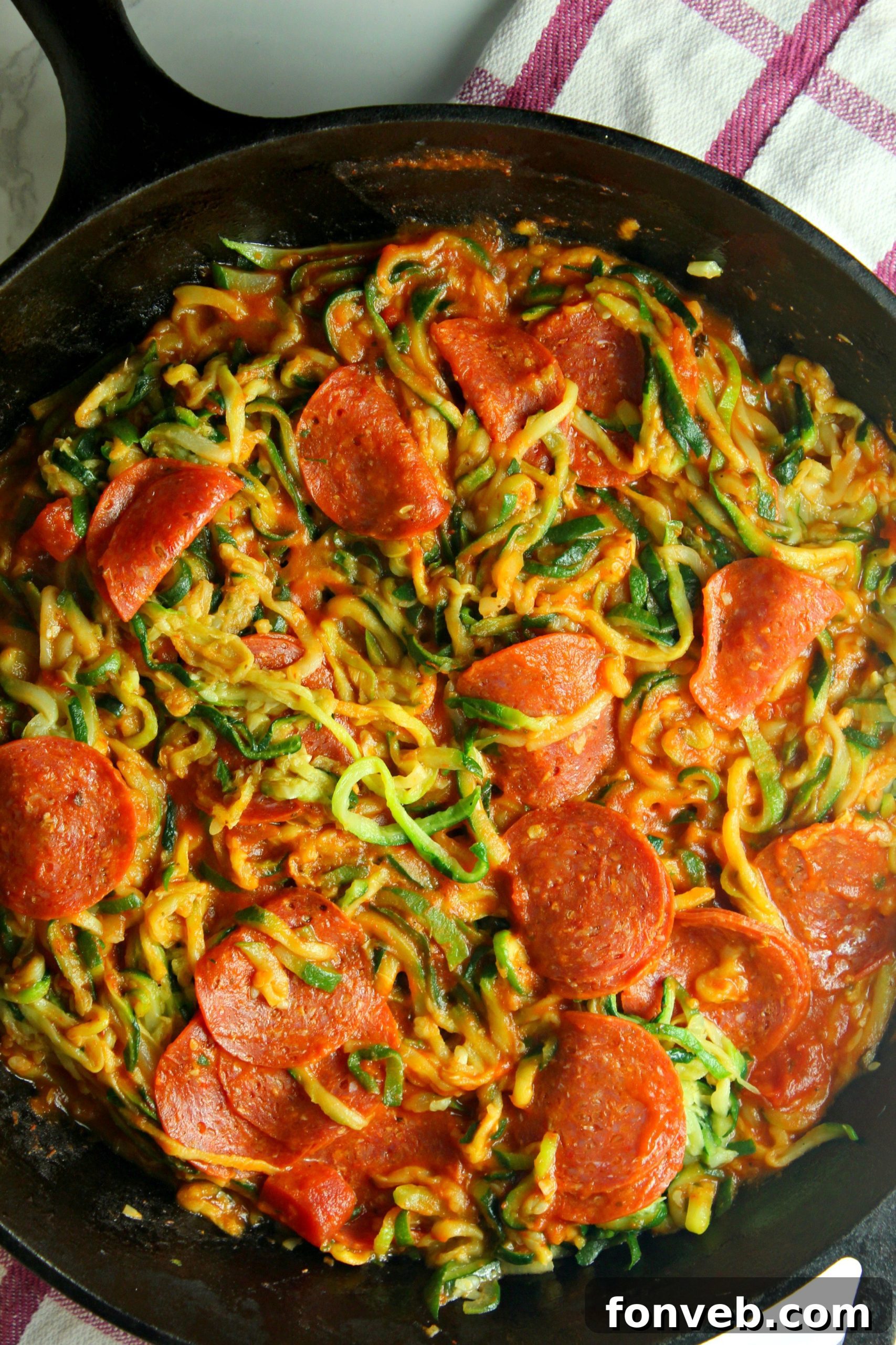 A full, inviting plate of Pizza Zucchini Pasta, ready to be savored