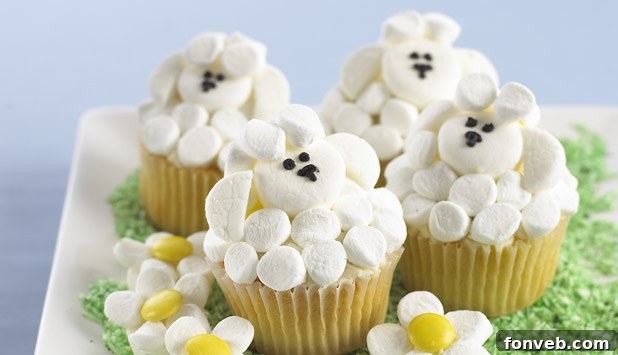 Miniature Easter basket cupcakes, decorated to resemble tiny baskets filled with edible grass and candy eggs.
