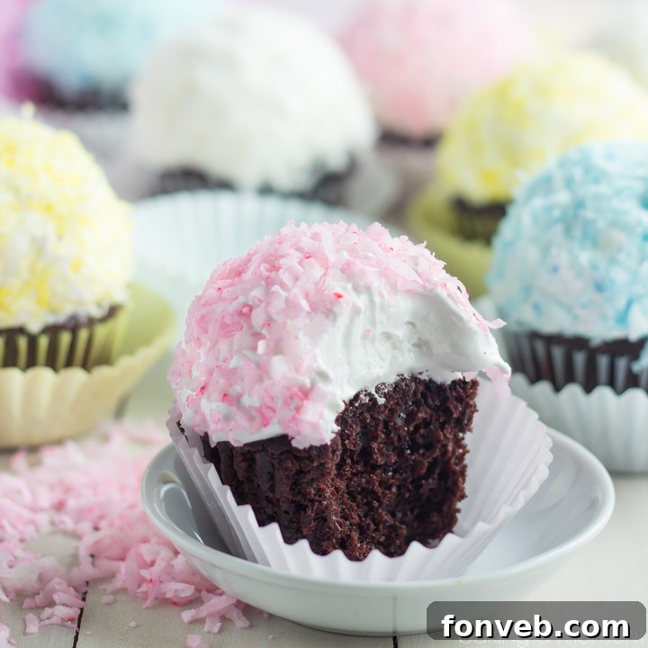 Charming marshmallow sheep cupcakes with fluffy white marshmallow bodies and cute edible faces.
