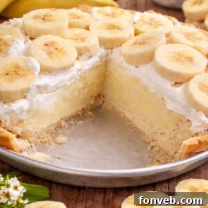 Old Fashioned Banana Cream Pie in a pie dish, with a slice removed