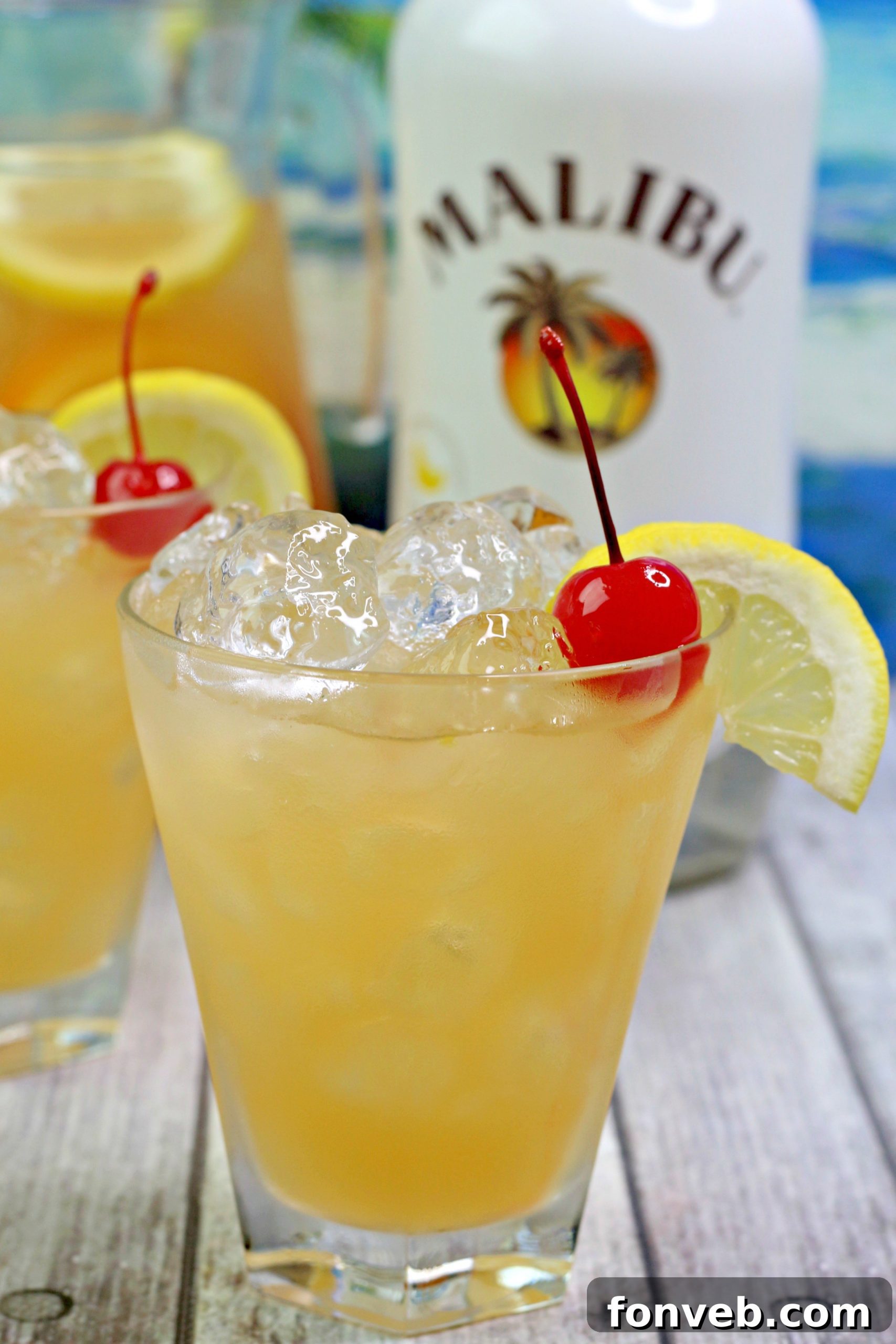 Refreshing Banana Rum Punch garnished with orange and lemon slices, ready to be served