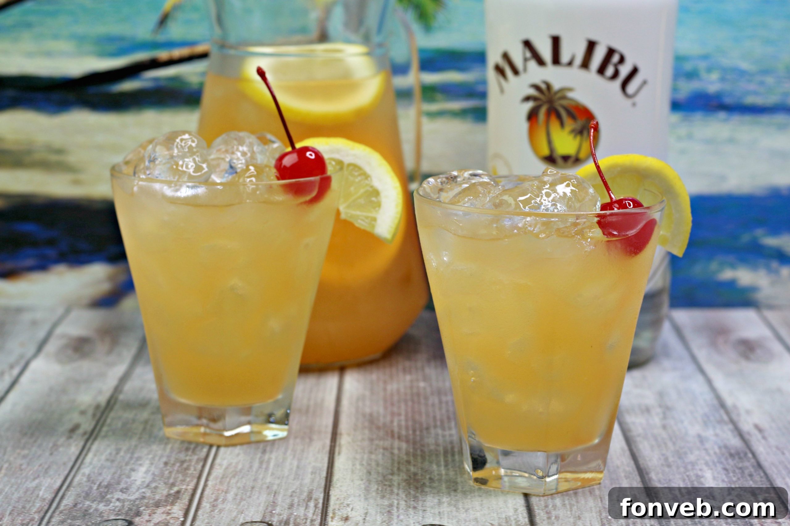 A close-up of the banana rum punch in a glass with a straw, ready for sipping