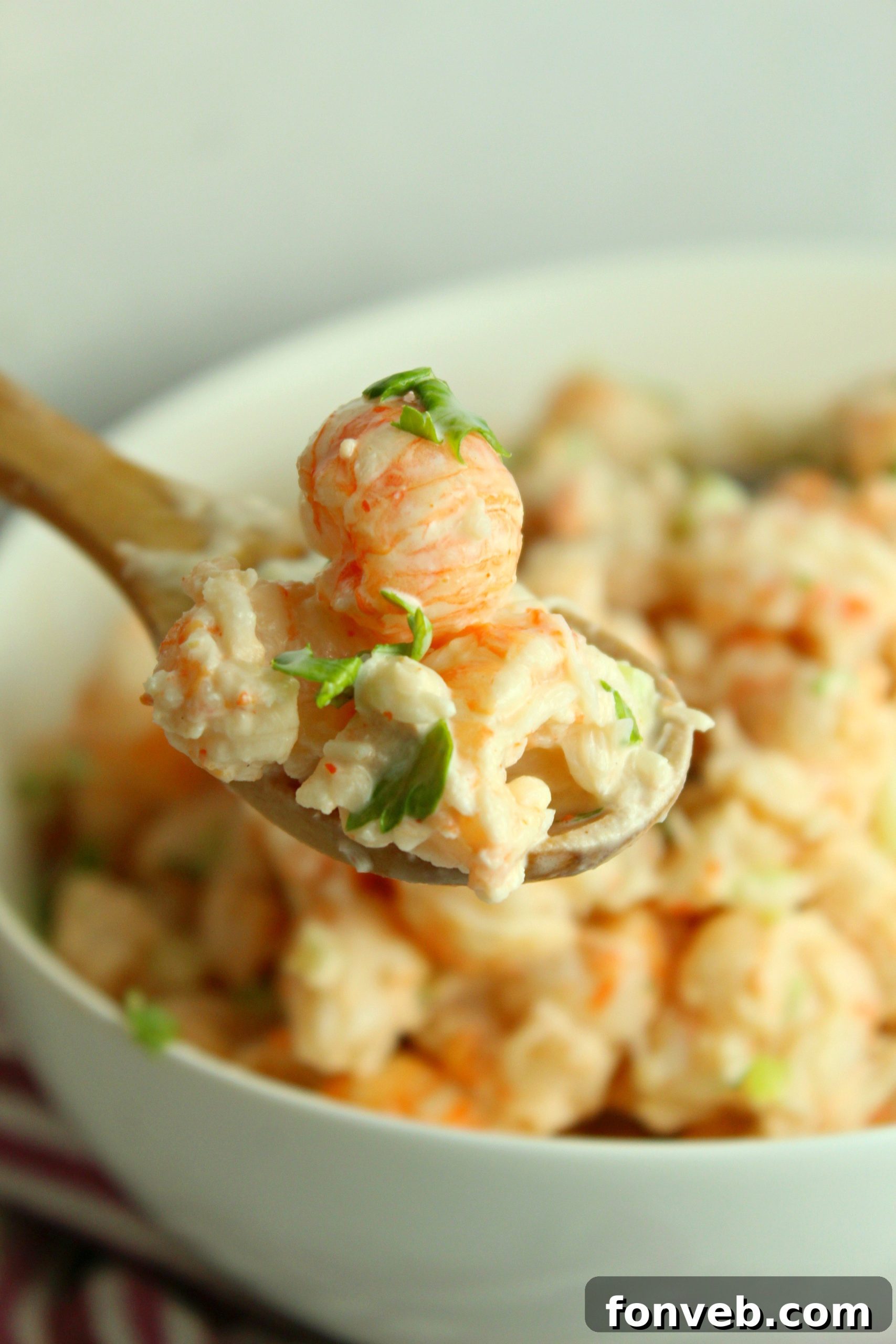 Hands preparing lobster rolls