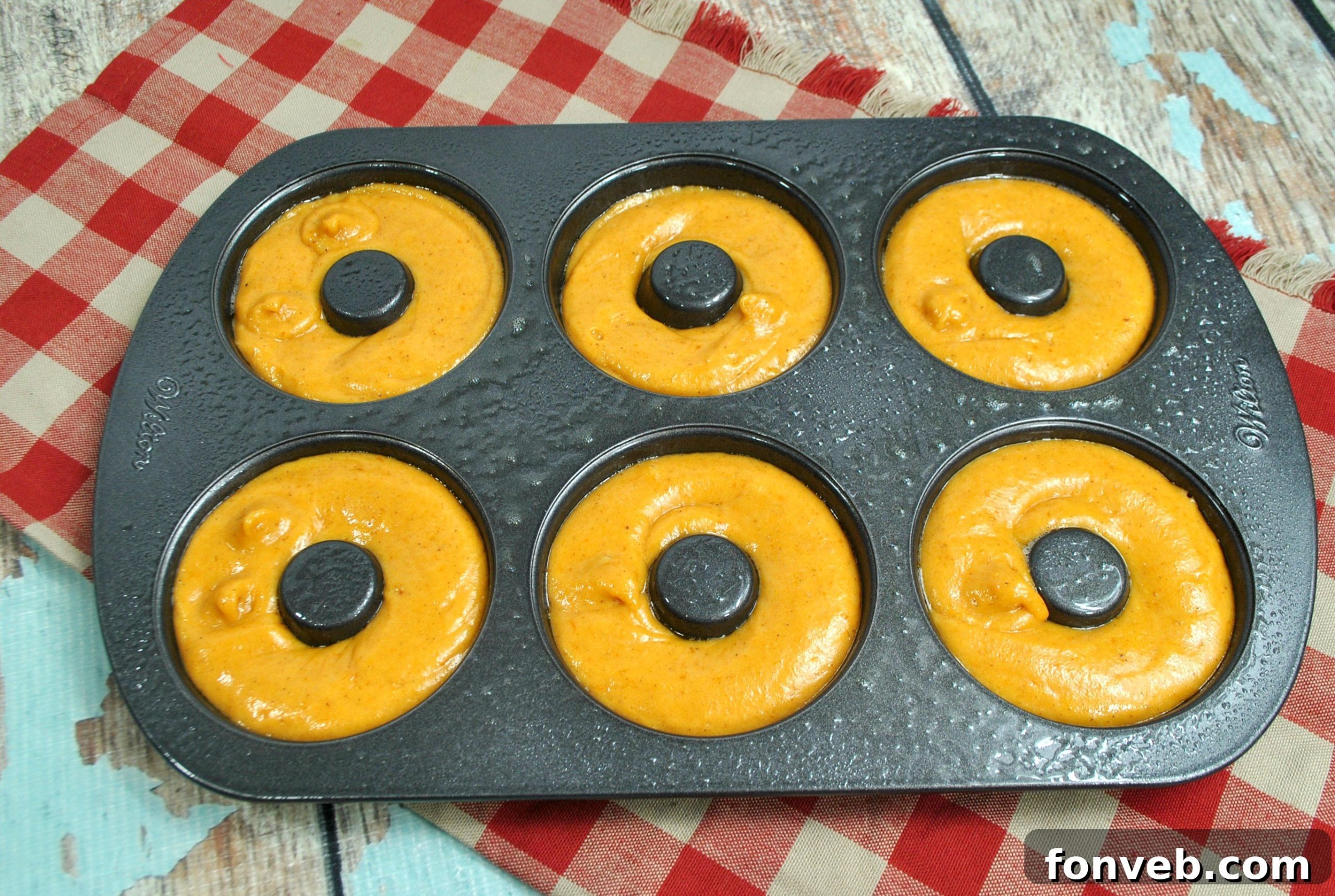 Spiced Autumn Donut Perfection 3 Close-up of baked pumpkin spice donuts, highlighting their soft texture