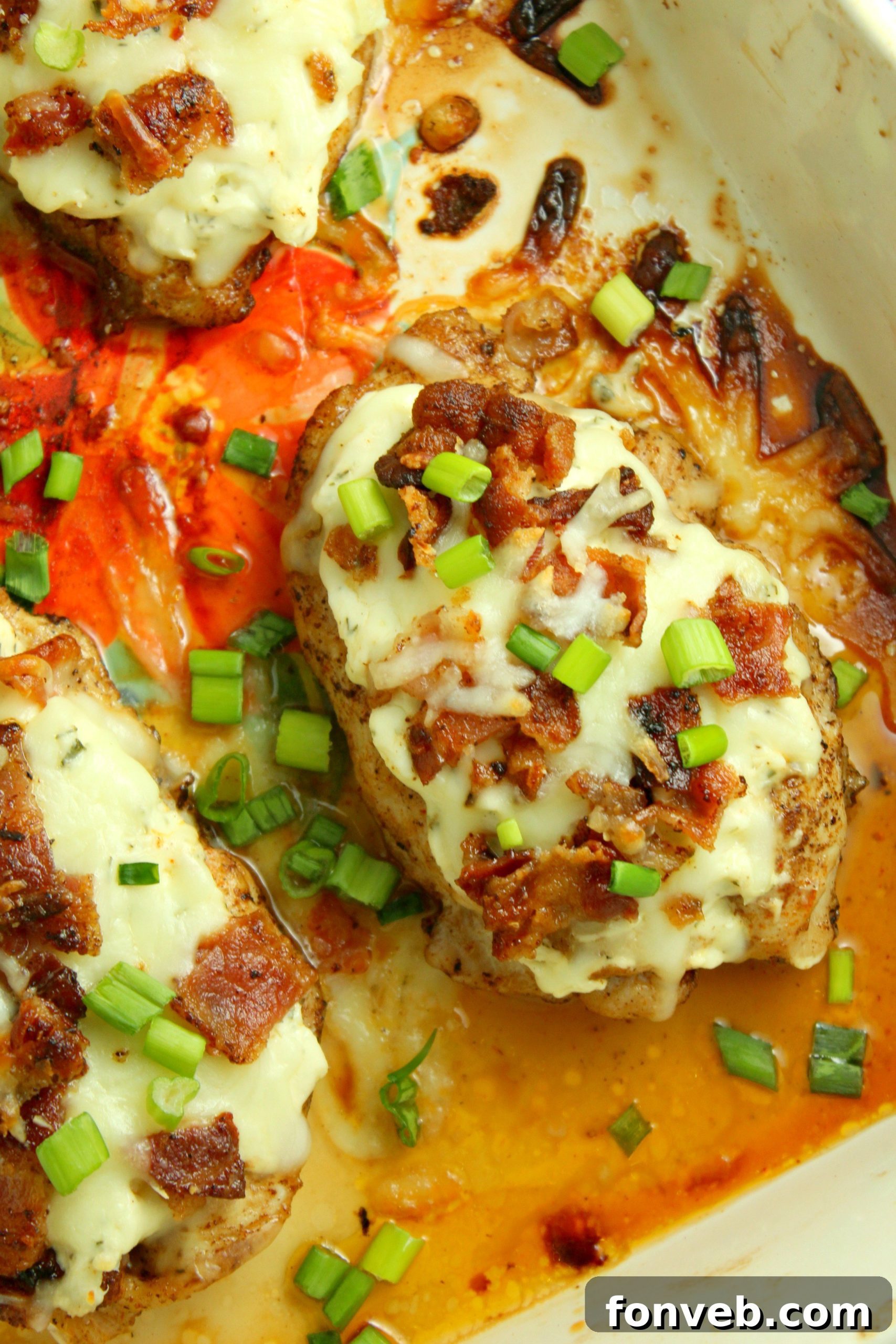 Smothered Crack Chicken garnished with green onions and bacon