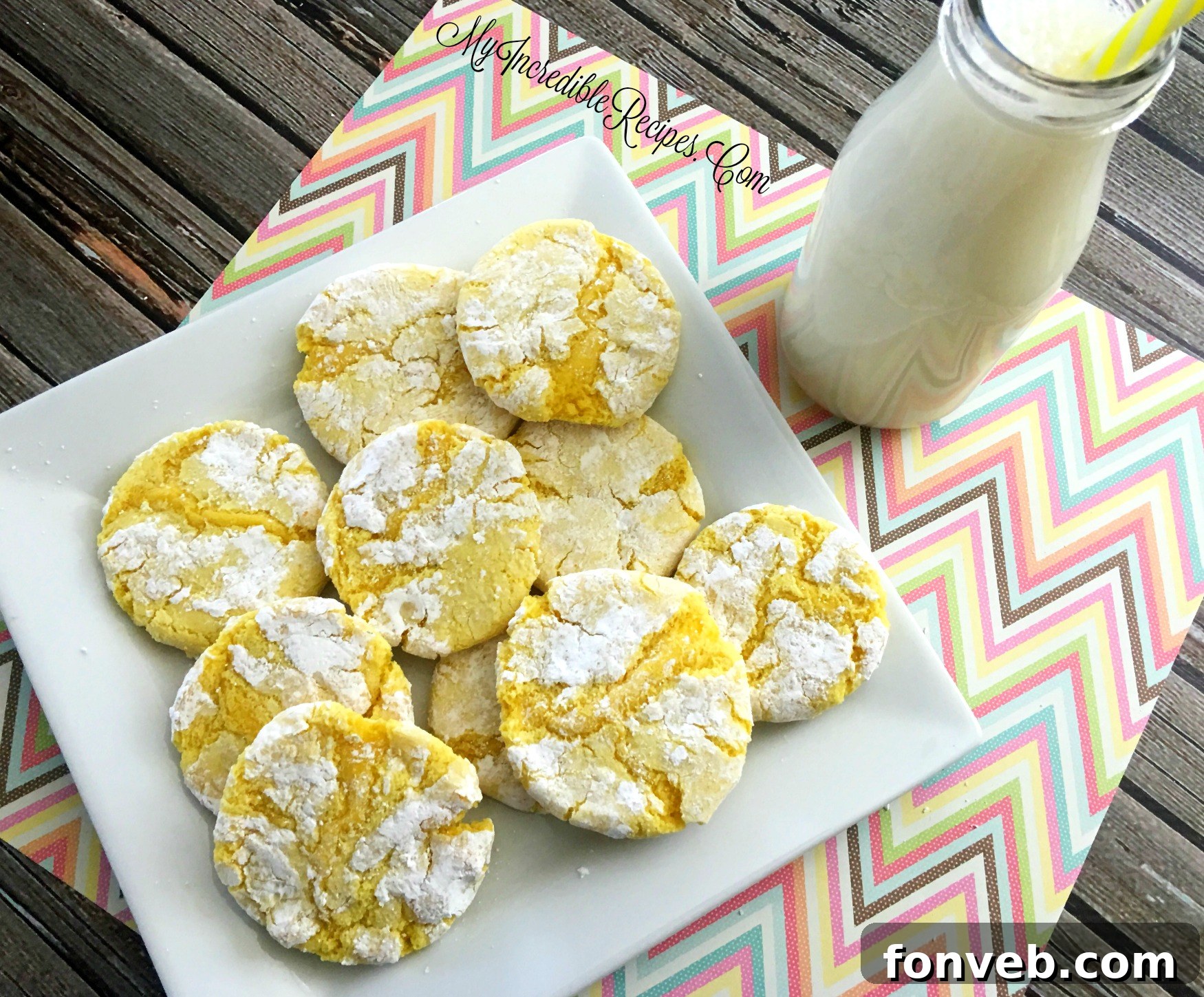 Zesty Lemon Crinkle Cookies 3 lem1 - Close-up of a single Lemon Crinkle Cookie, showing its soft texture and powdered sugar coating