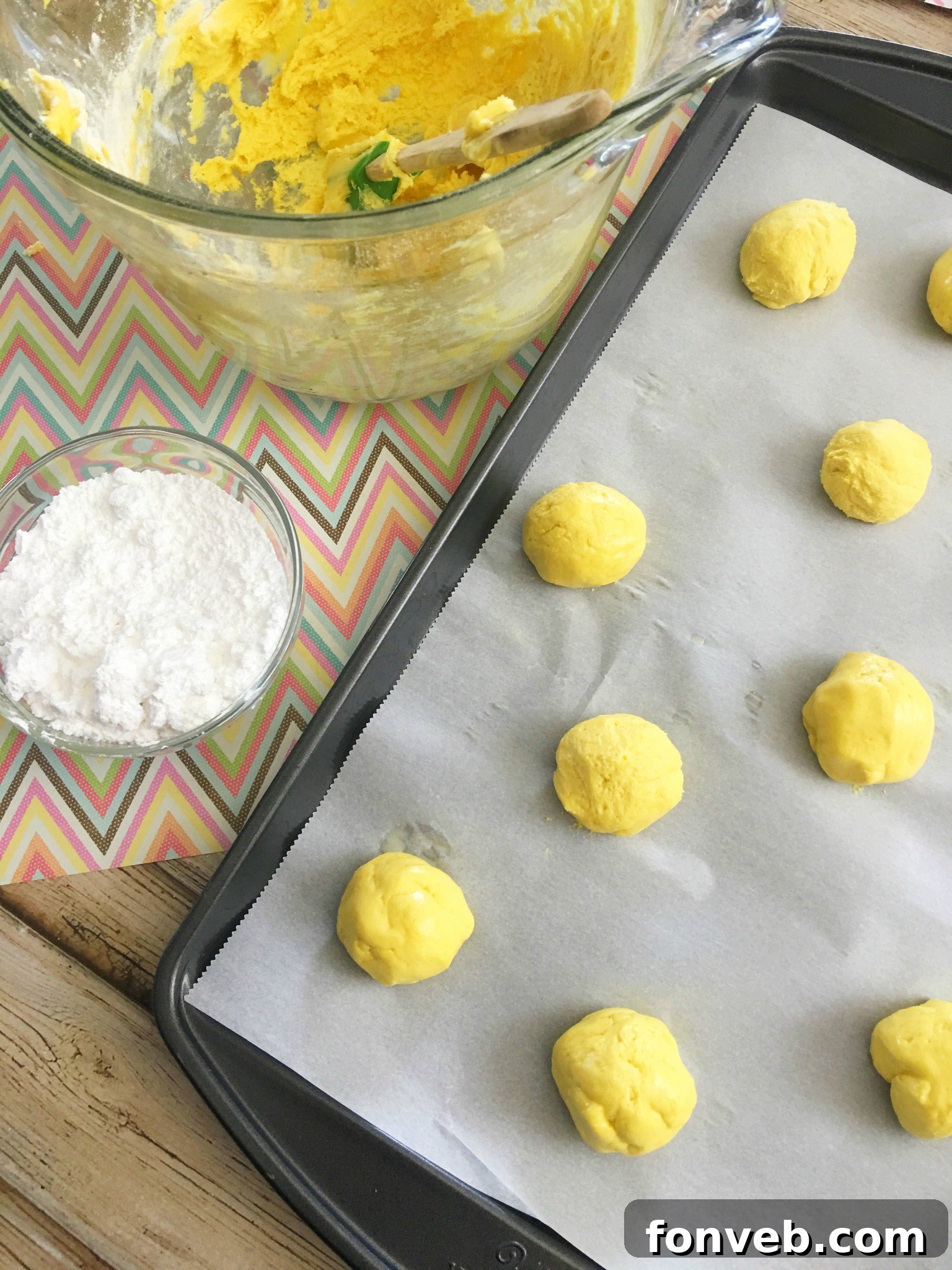 lem3 - Hand holding a freshly baked Lemon Crinkle Cookie
