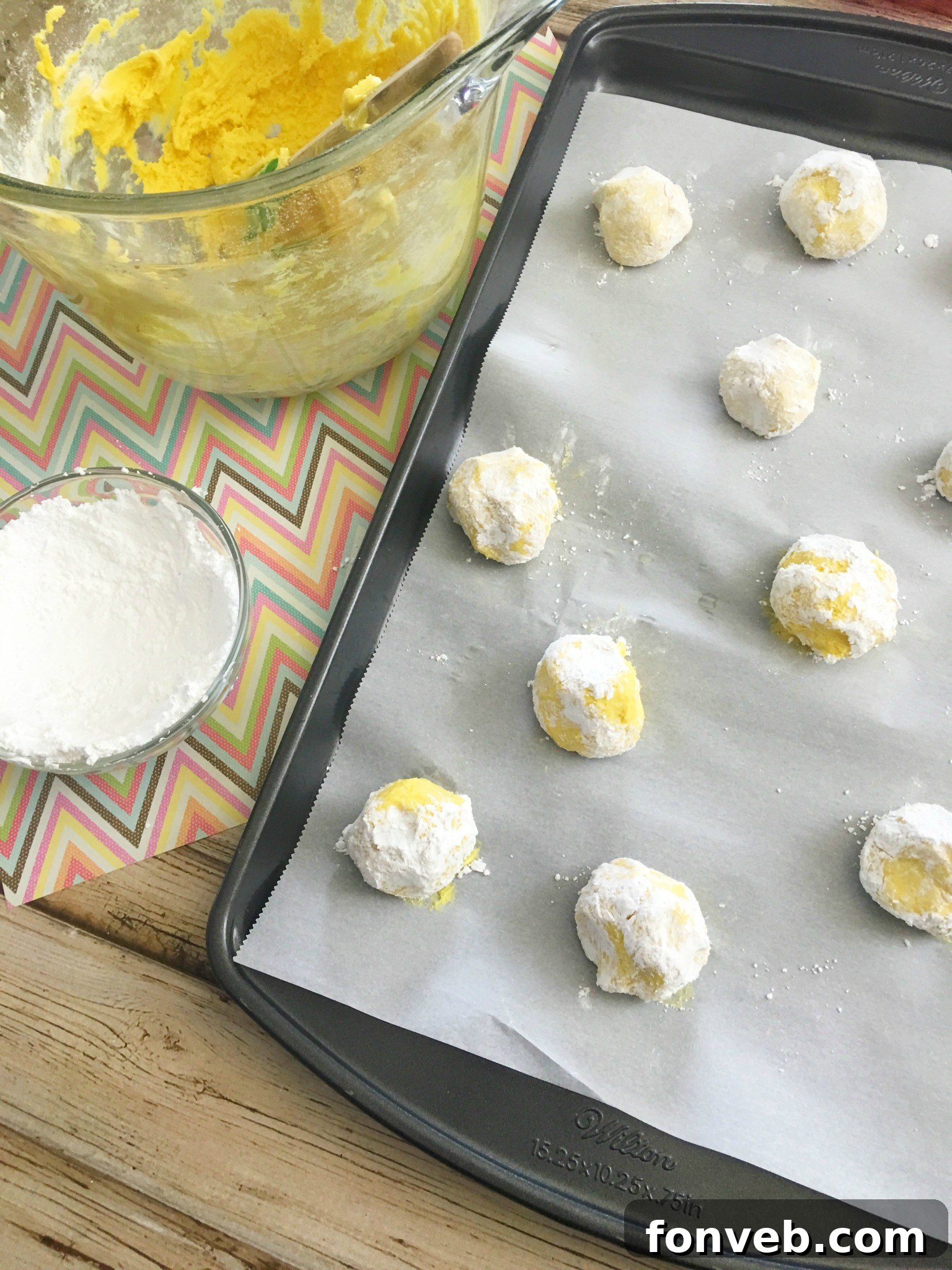 Zesty Lemon Crinkle Cookies 8 lem6 - Freshly baked Lemon Crinkle Cookies with a dusting of powdered sugar