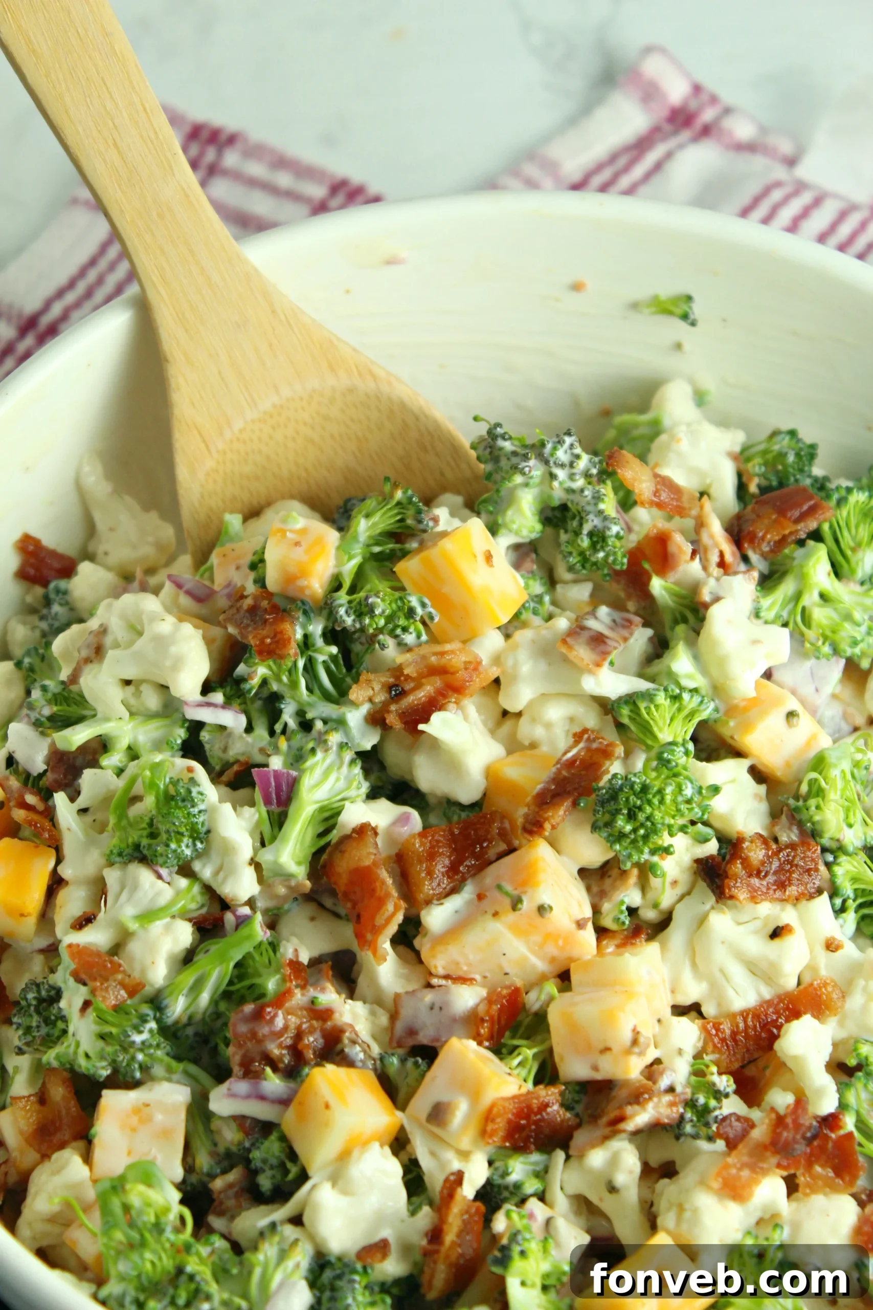 Close-up of the creamy dressing being whisked in a bowl.