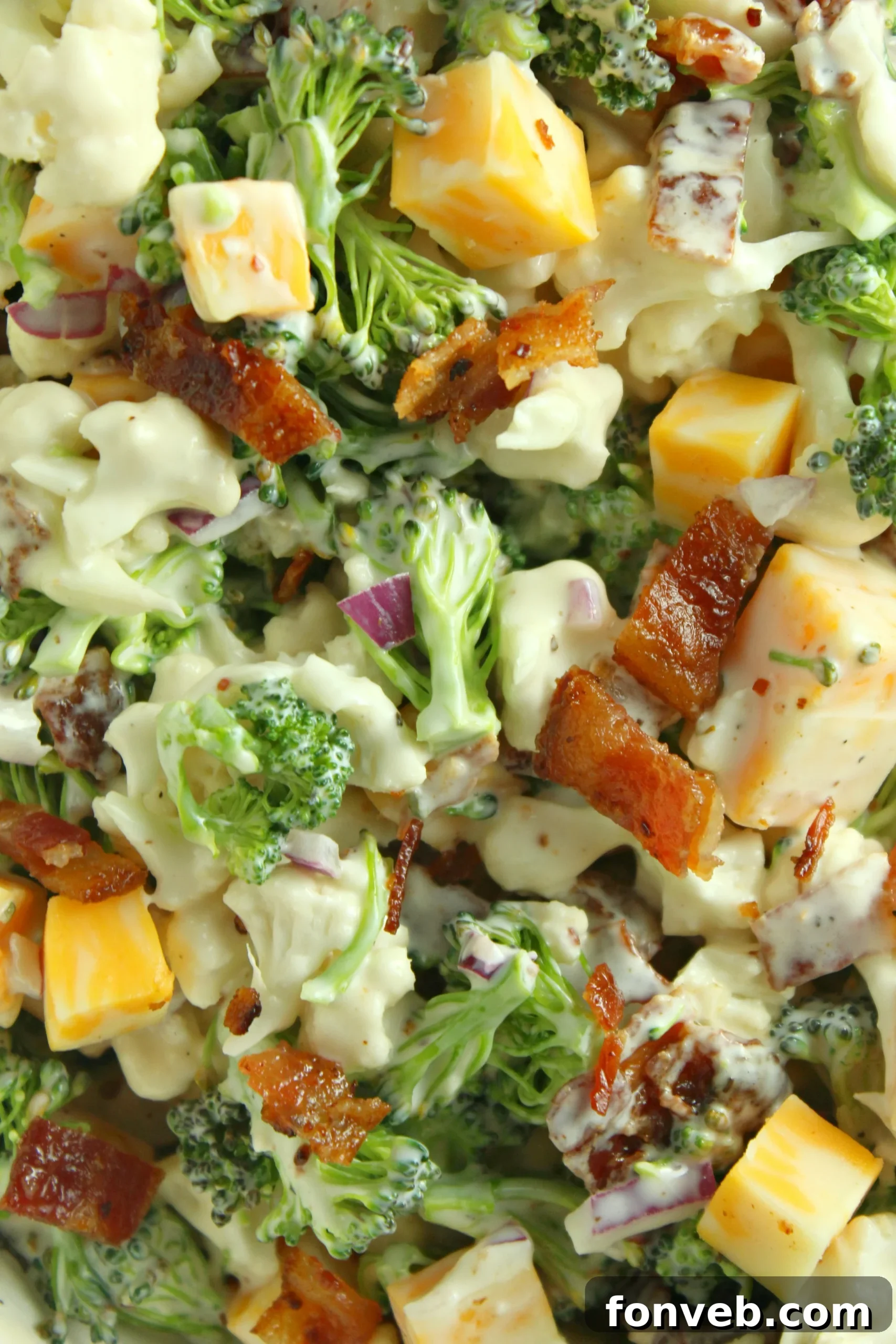 Another perspective of the assembled Loaded Broccoli Cauliflower Salad in a serving bowl.