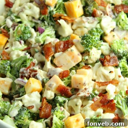 Close-up of the Loaded Broccoli Cauliflower Salad in a white bowl