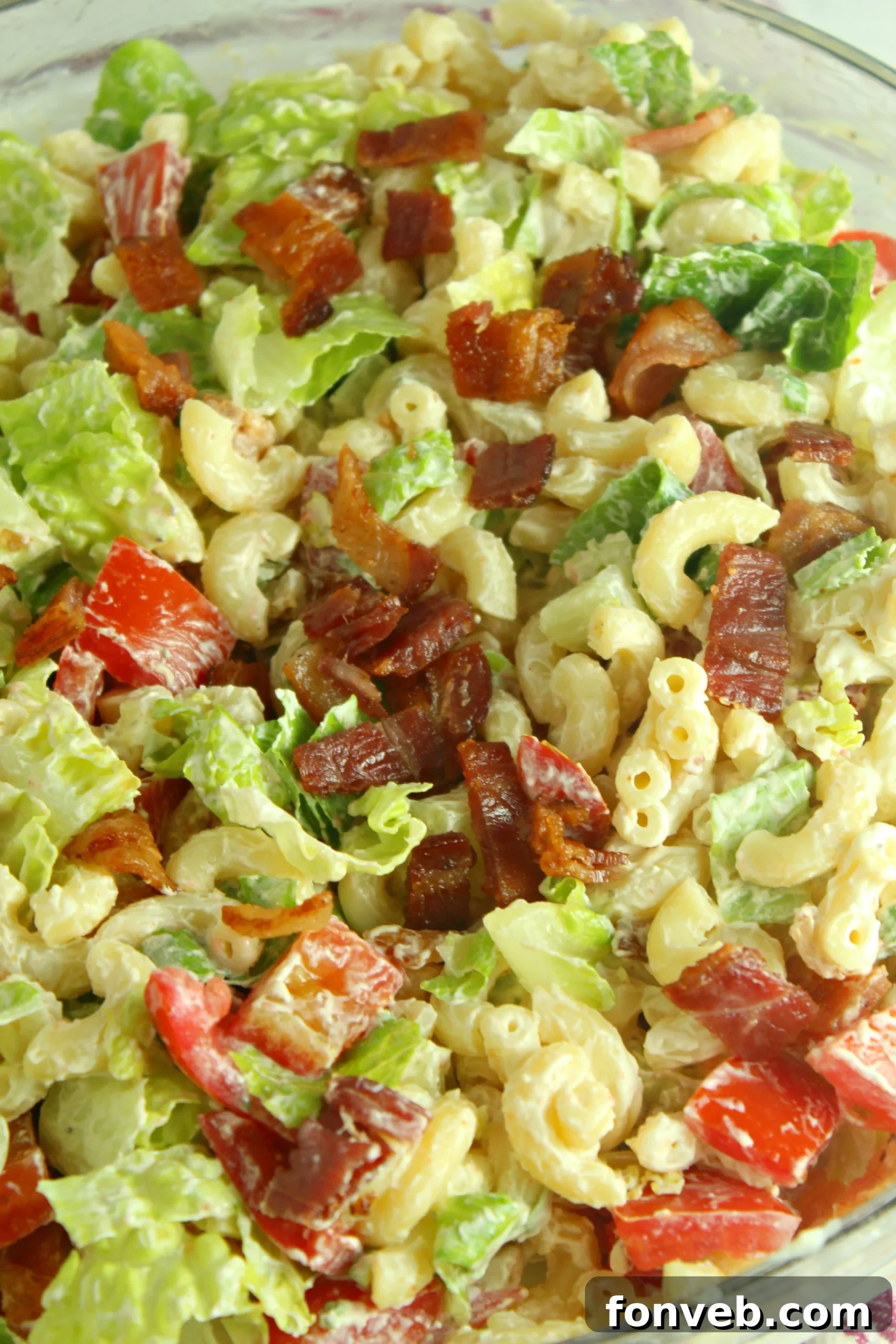 Freshly prepared BLT Pasta Salad in a large bowl, ready to be served at a summer BBQ.