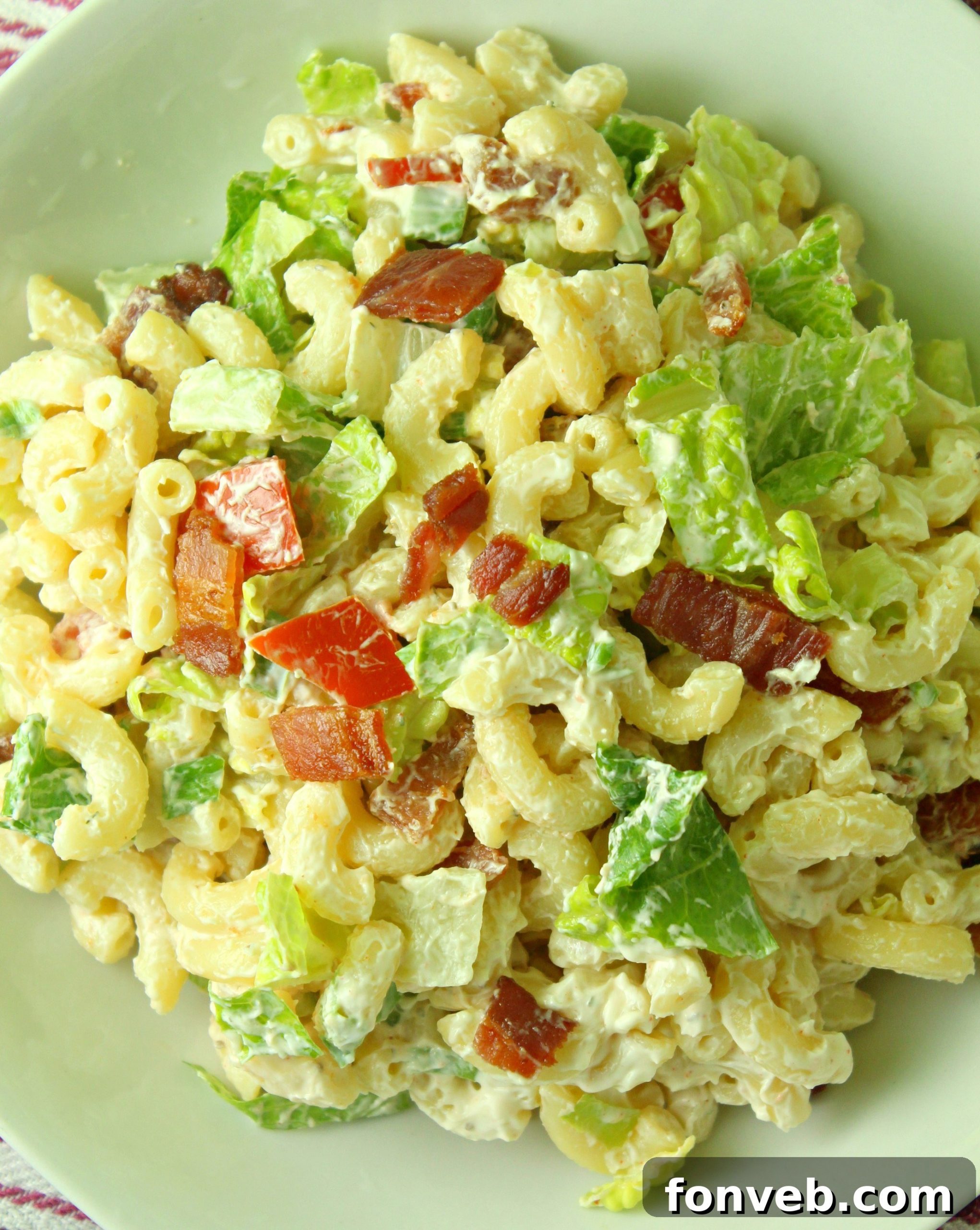 A close-up of a single serving of BLT Pasta Salad, ready to be enjoyed.