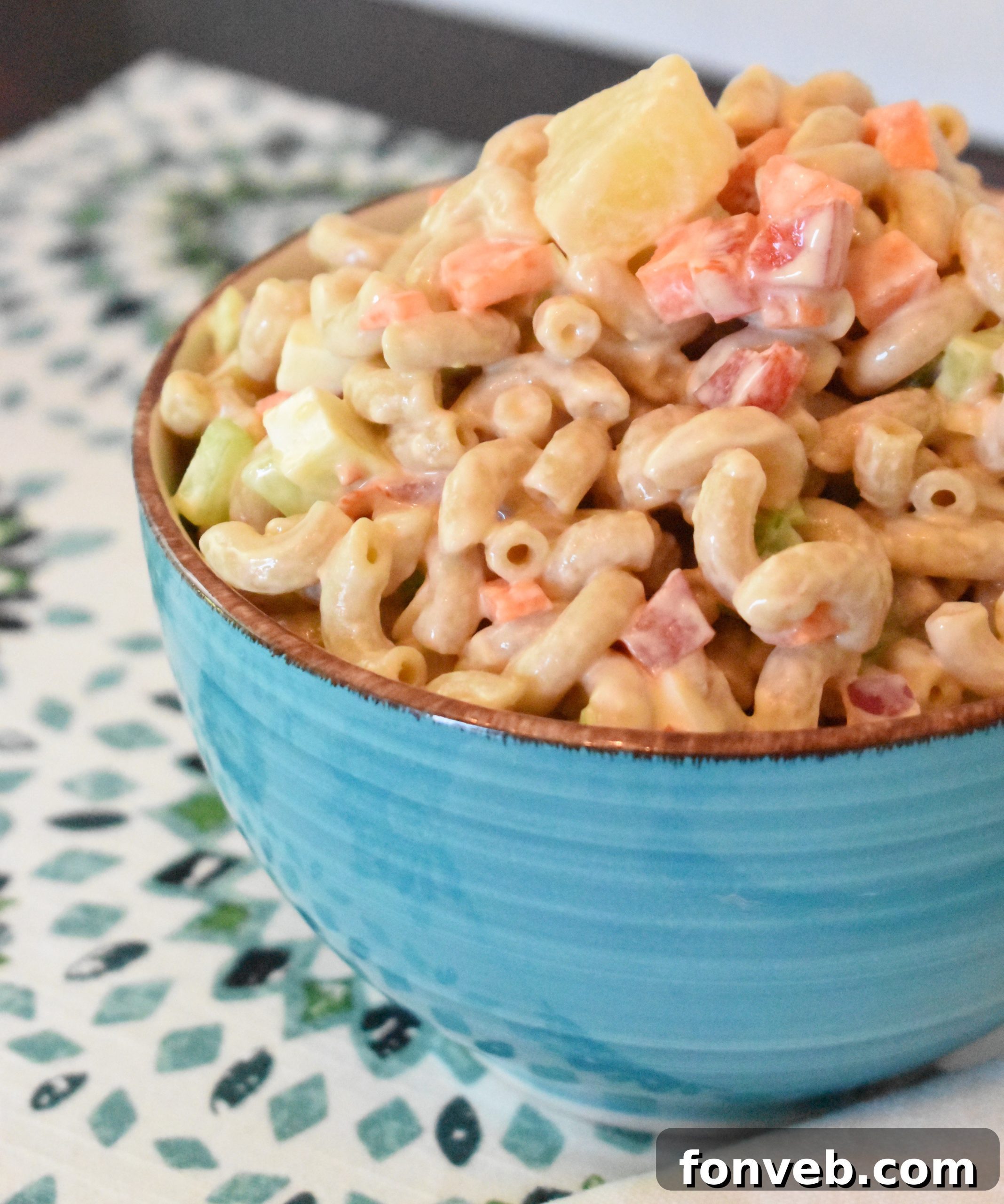 Vibrant Tropical Macaroni Salad in a large serving bowl