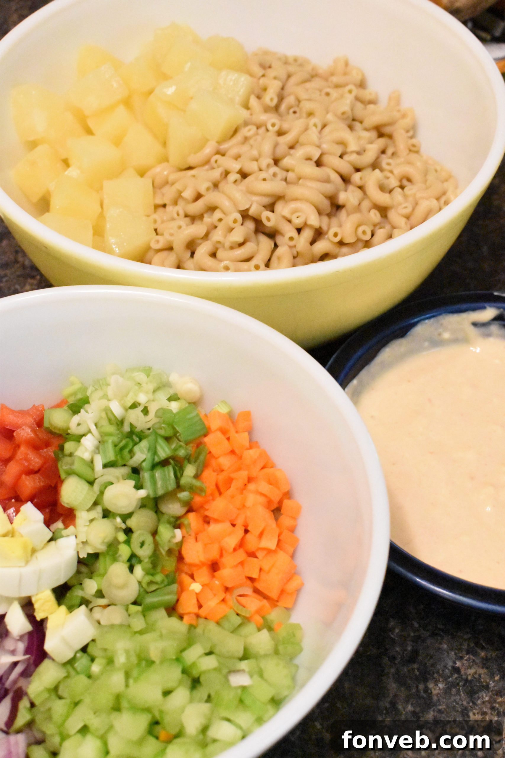 Close-up of Tropical Macaroni Salad with colorful vegetables and pineapple