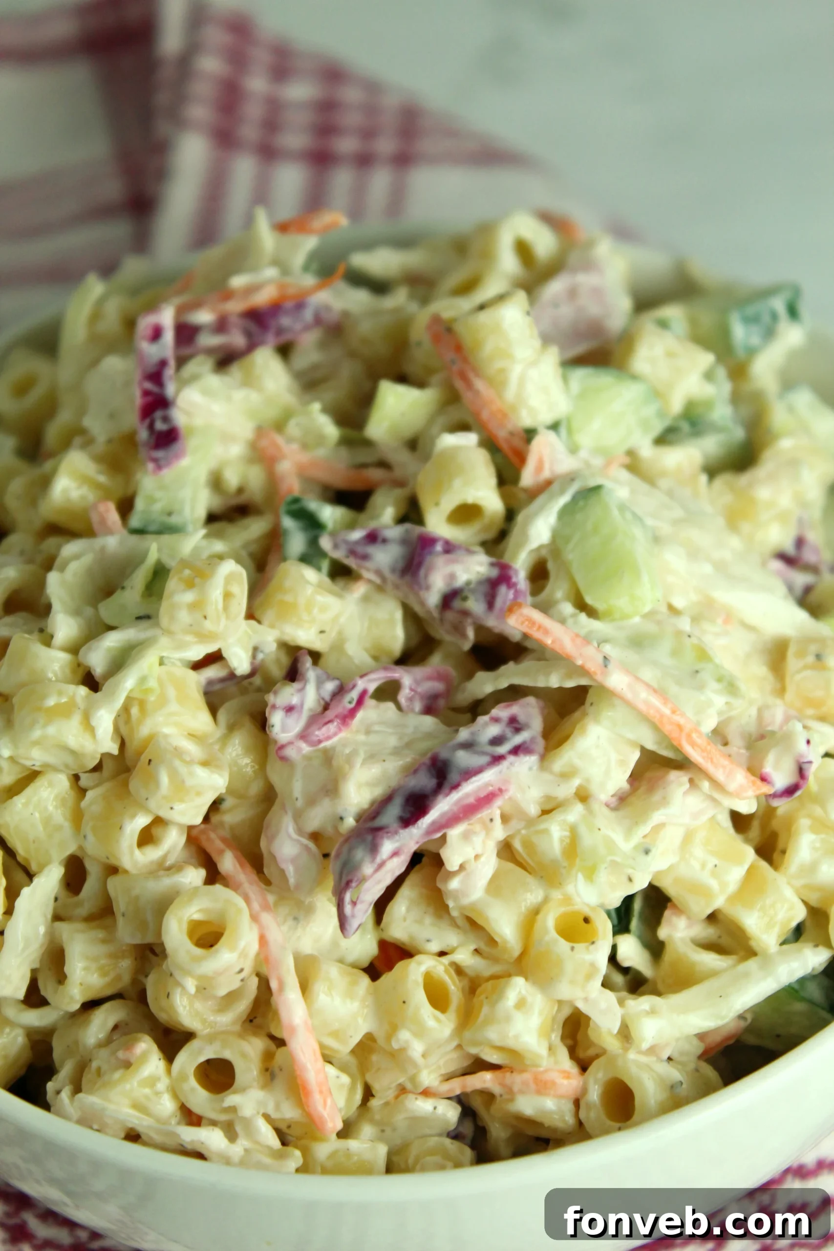 Coleslaw Pasta Salad overflowing in a large serving bowl, ready for a summer party.