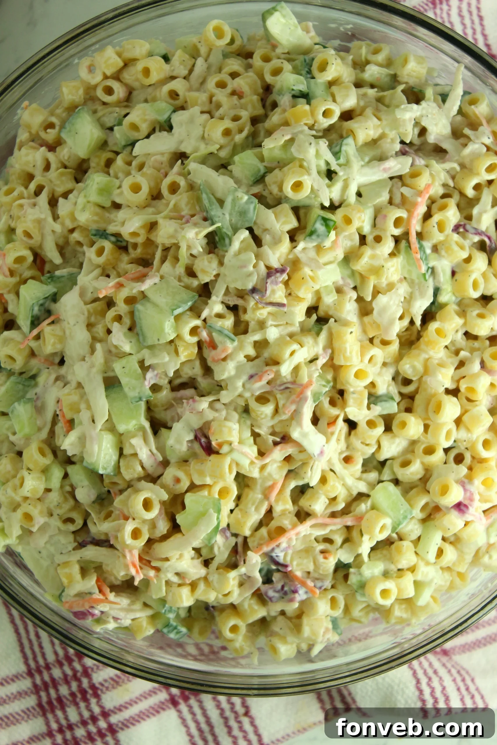 Close-up of Coleslaw Pasta Salad showing the mix of pasta, coleslaw, and vegetables.