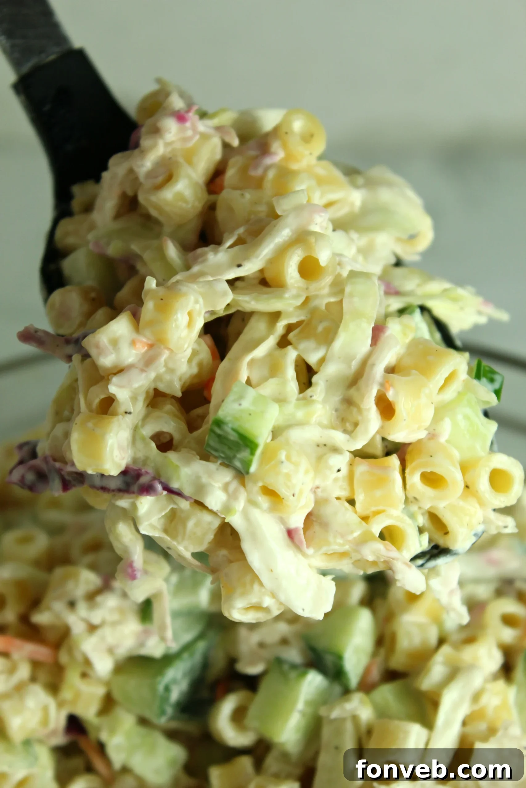 A bowl of uncooked ditalini pasta, ready for the Coleslaw Pasta Salad.