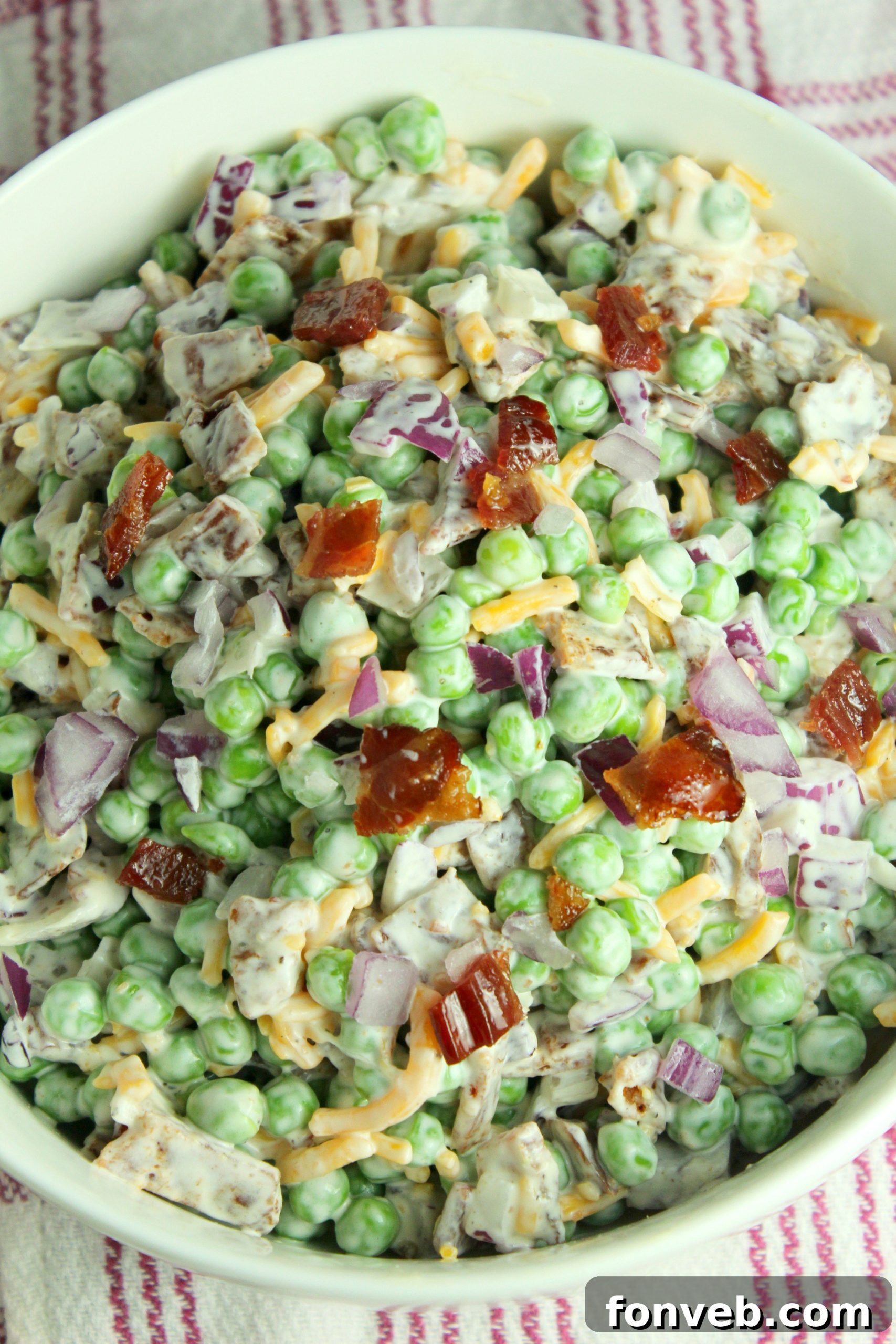 Smoky Bacon and Sweet Pea Salad 9 A final, mouth-watering shot of the Creamy Bacon Pea Salad in a beautiful serving bowl, ready for enjoyment.