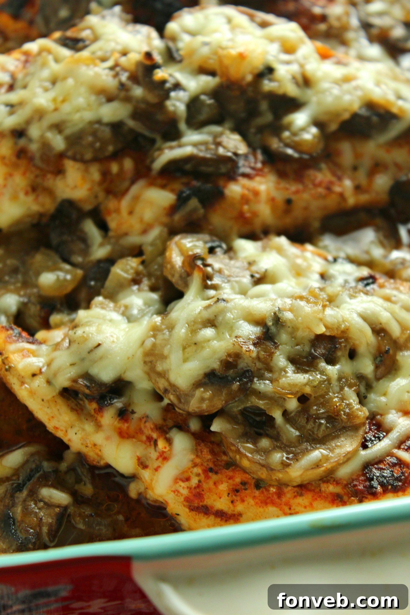 Creamy Cheesy Mushroom Chicken Keto Bake 5 Raw chicken breasts seasoned with paprika and Italian seasoning, ready for searing.