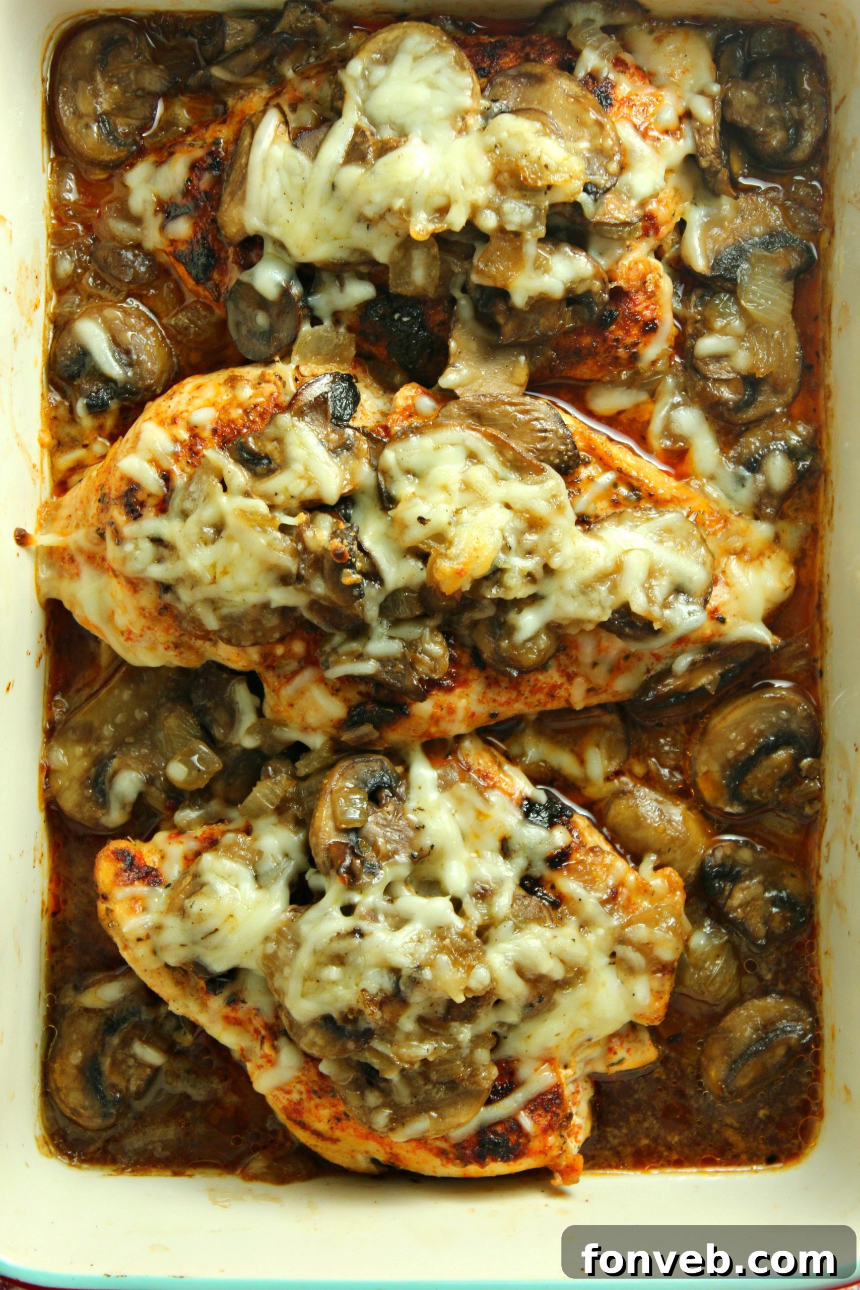 Creamy Cheesy Mushroom Chicken Keto Bake 7 The Smothered Cheesy Baked Chicken with Mushrooms, freshly out of the oven, with bubbling cheese and rich sauce.