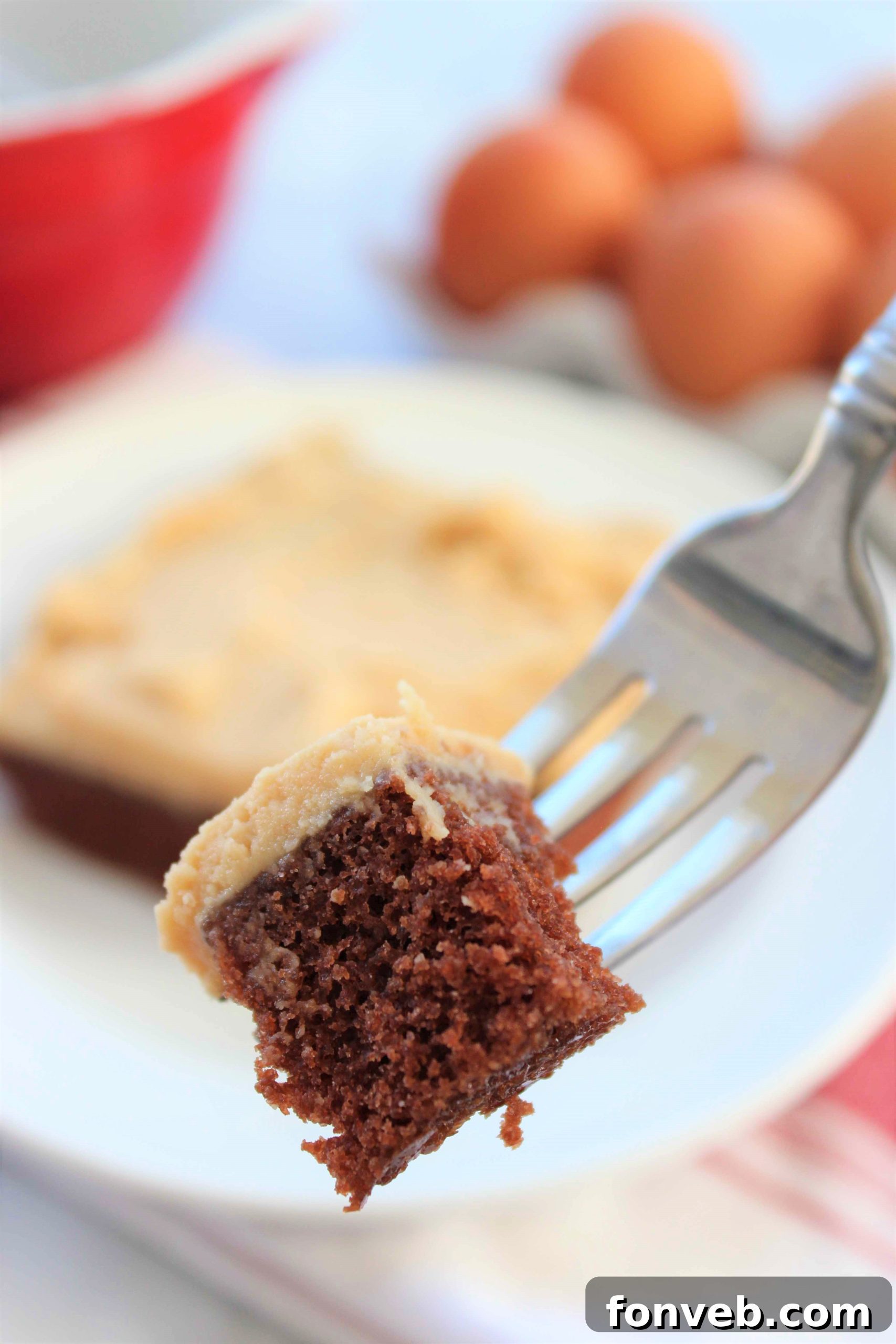 Ultimate Peanut Butter Texas Sheet Cake 6 A close-up shot of the creamy, textured peanut butter frosting covering the entire surface of the chocolate Texas Sheet Cake.