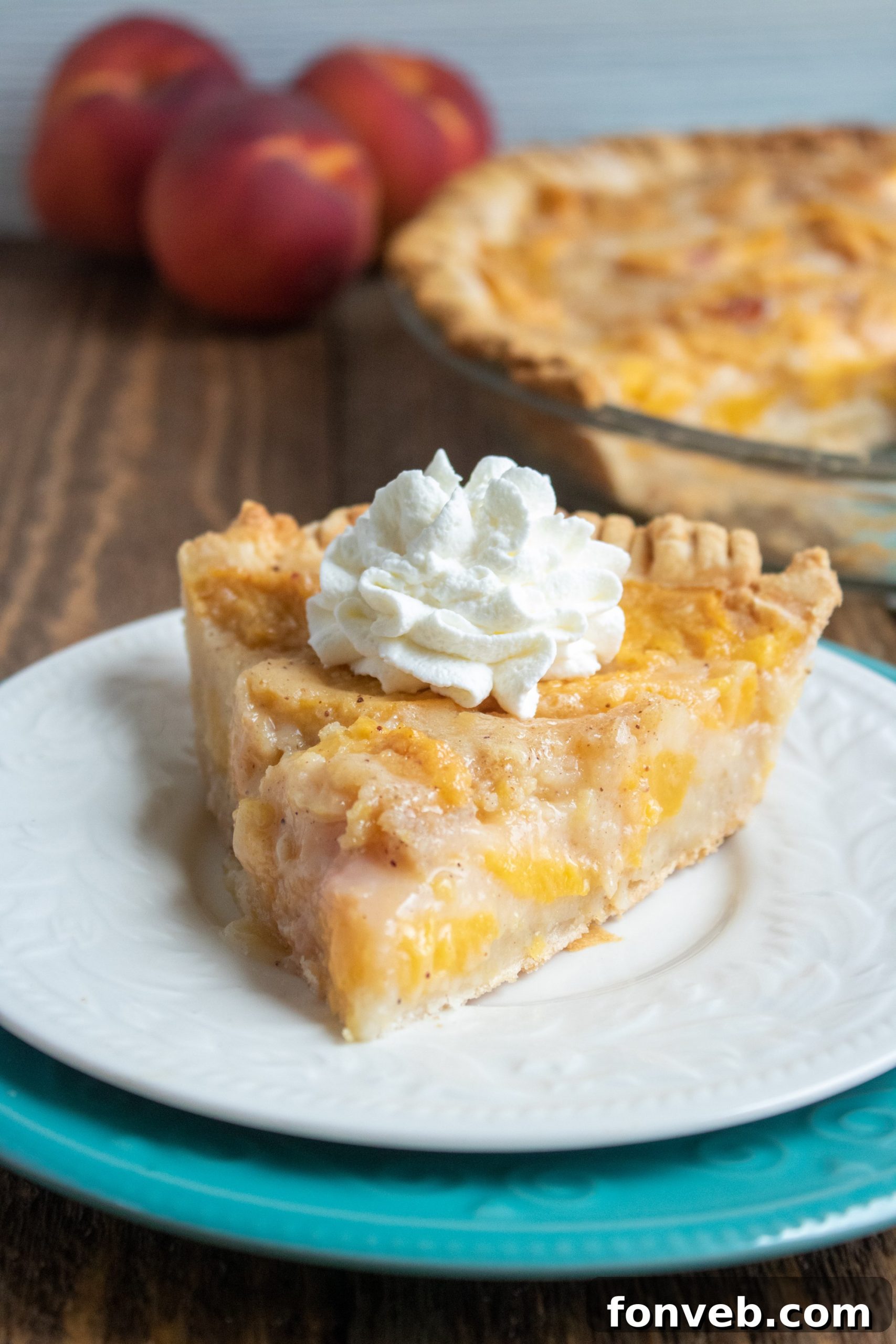 A rustic, perfectly golden-brown Southern Peach Pie cooling gracefully on a wire rack, ready to be enjoyed.