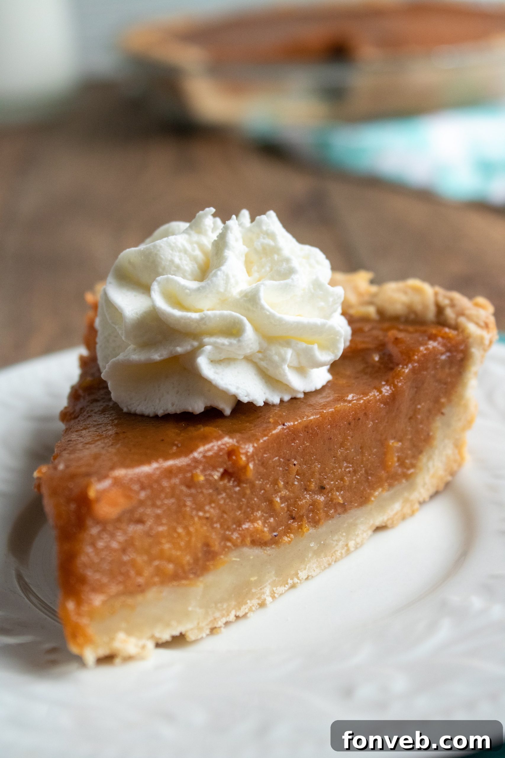 Delicious slice of homemade sweet potato pie with a golden crust