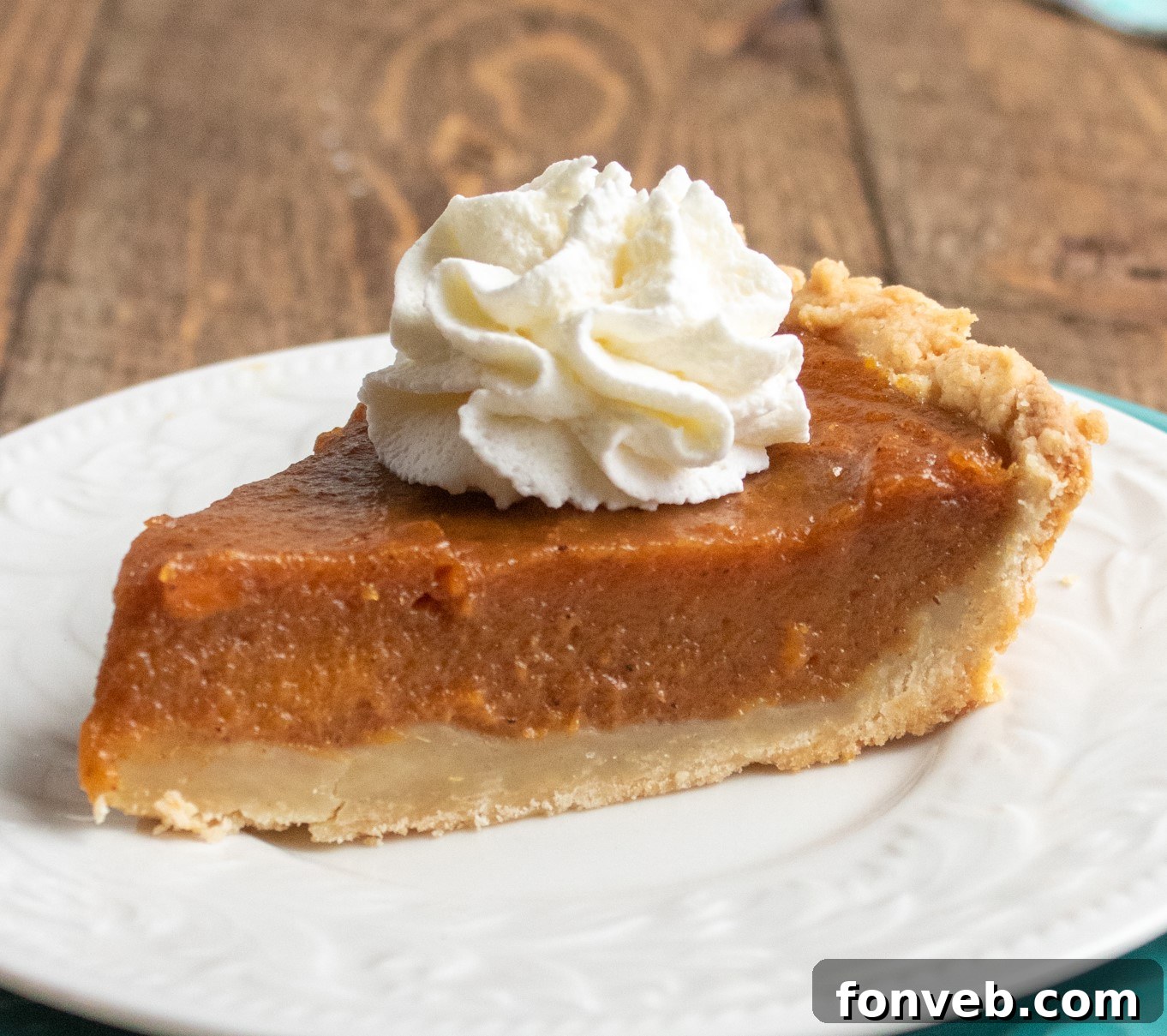 Sweet potato pie cooling on a wire rack, with a rustic charm