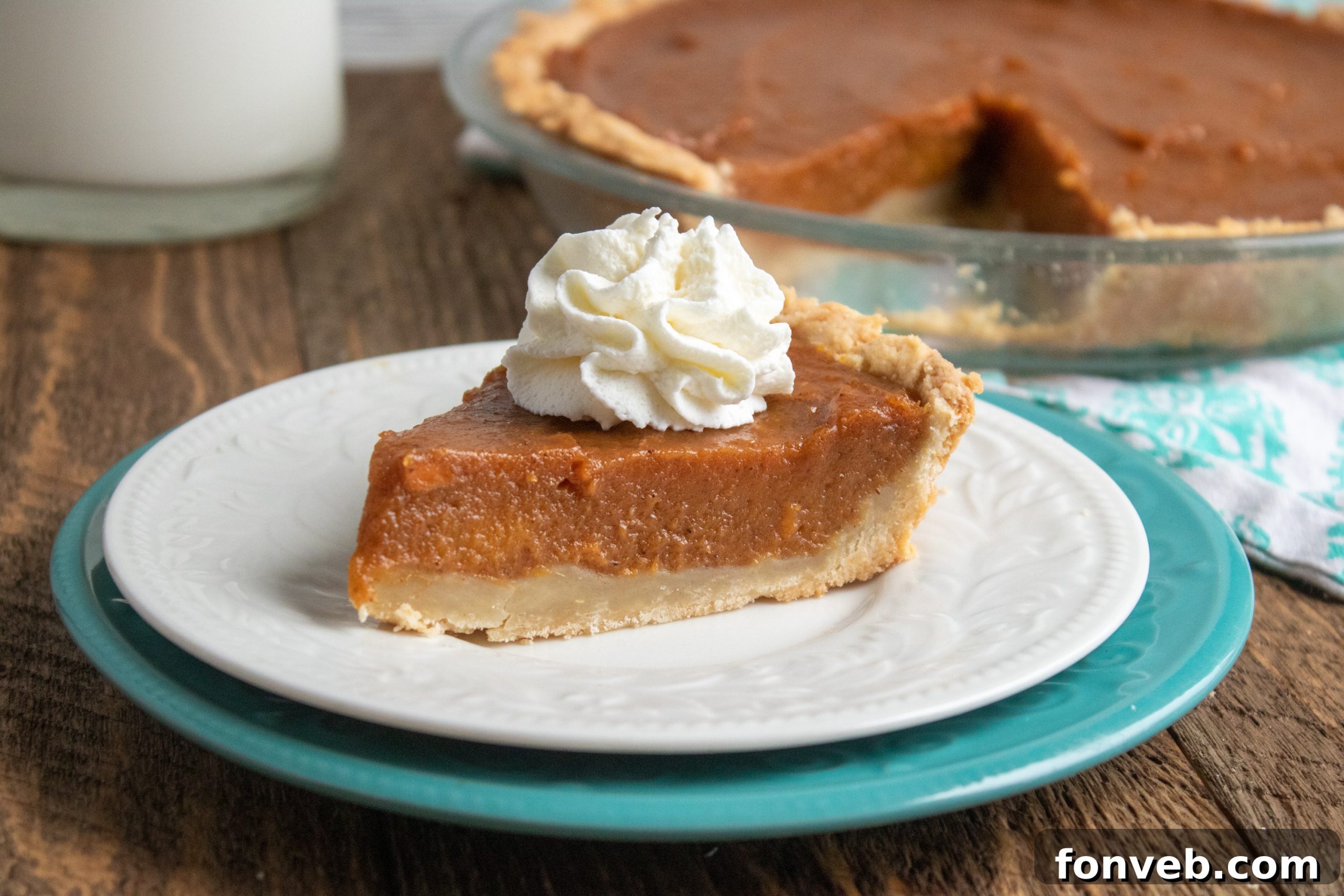 Close-up of a slice of sweet potato pie, showing its smooth texture