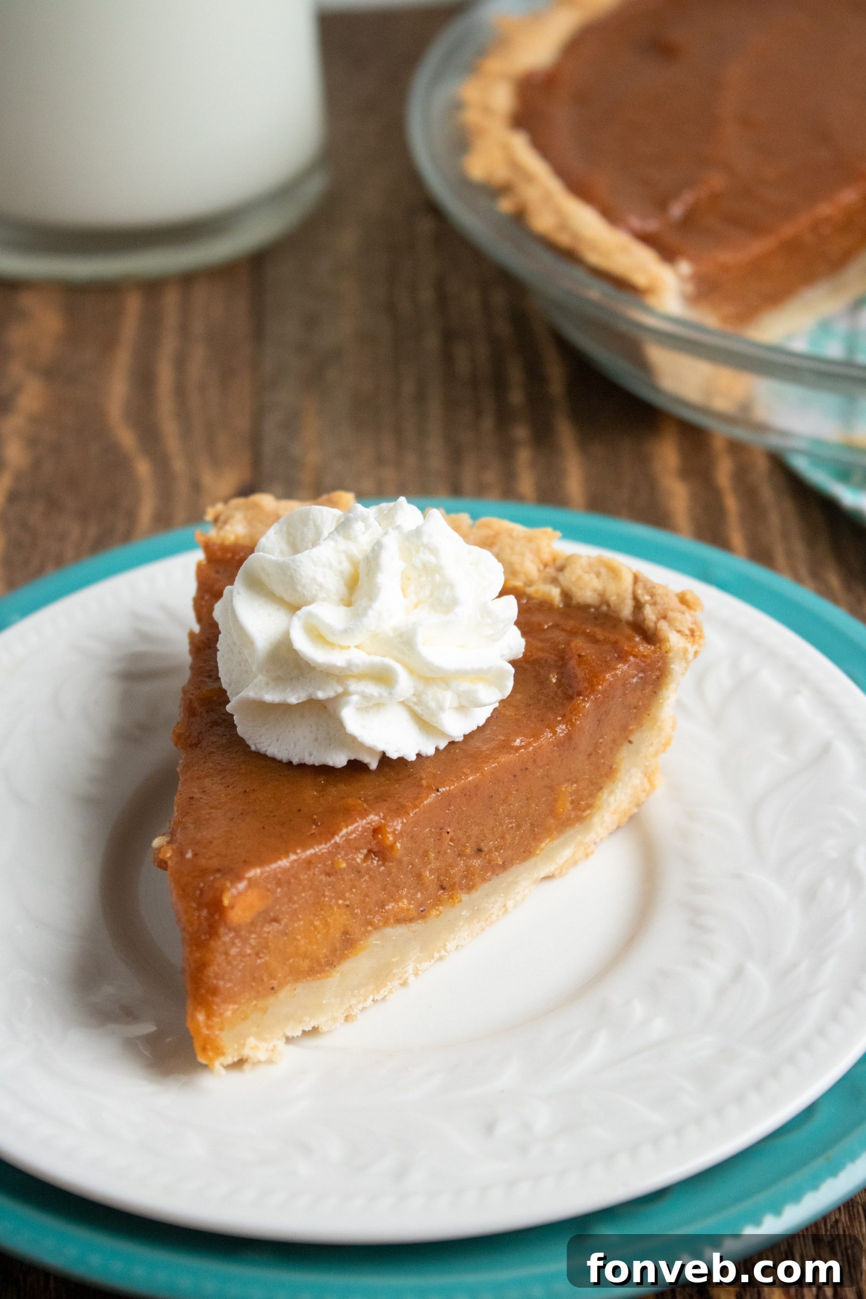Beautifully presented sweet potato pie on a rustic wooden table