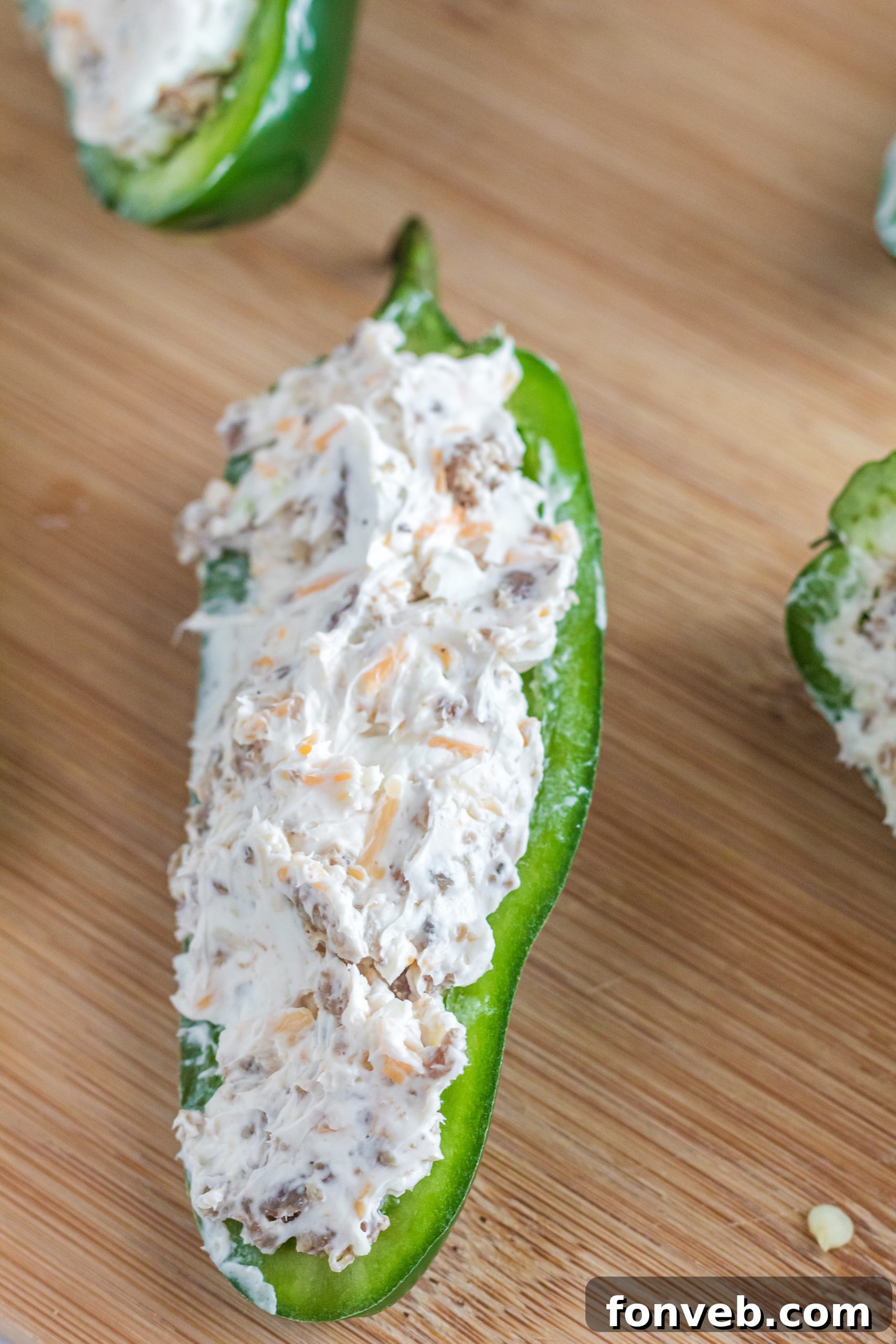 Tray of prepared jalapeno poppers ready for air frying