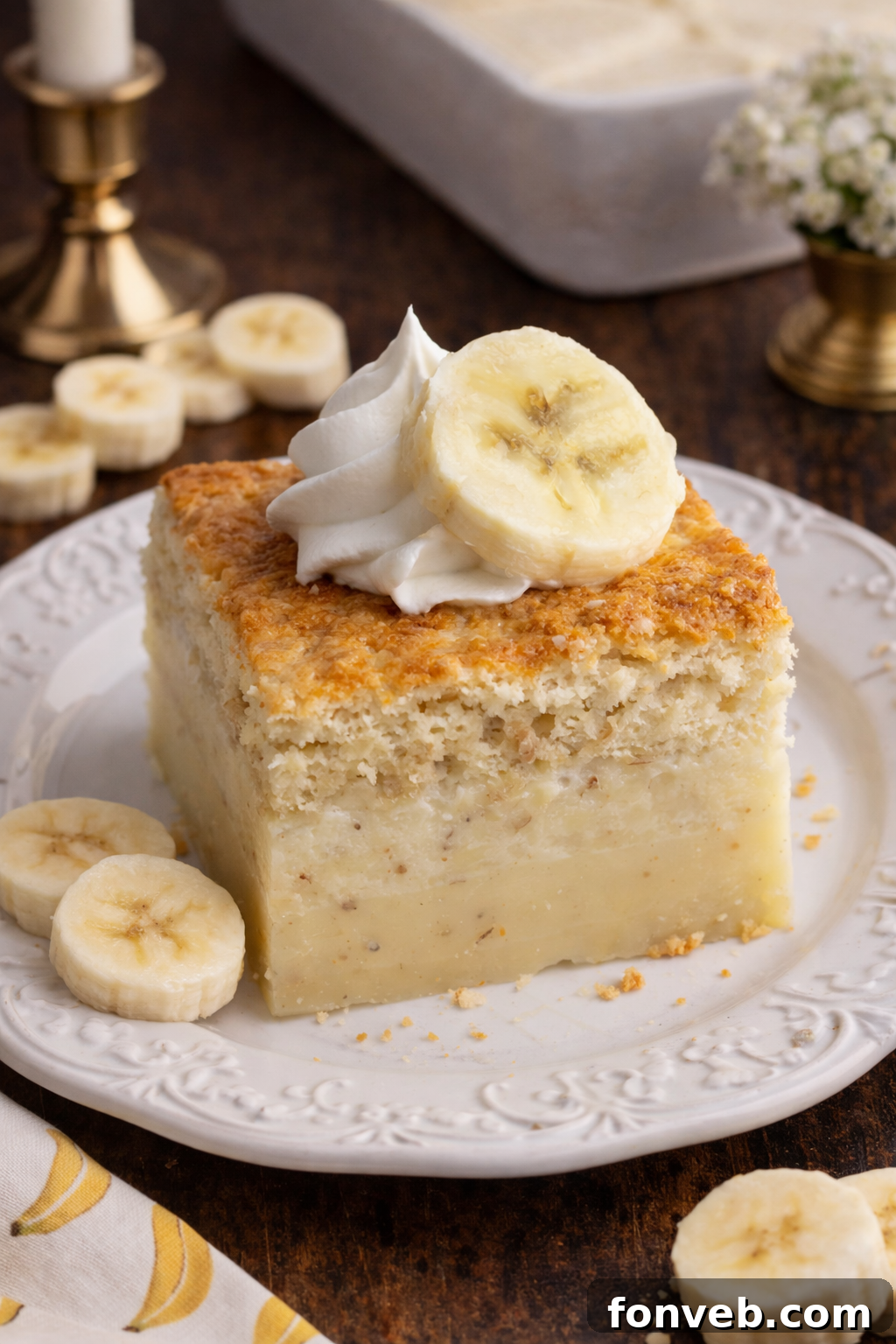 Banana Alchemy Cake 11 A final close-up image of a full Banana Magic Cake on a white plate, invitingly ready for serving.