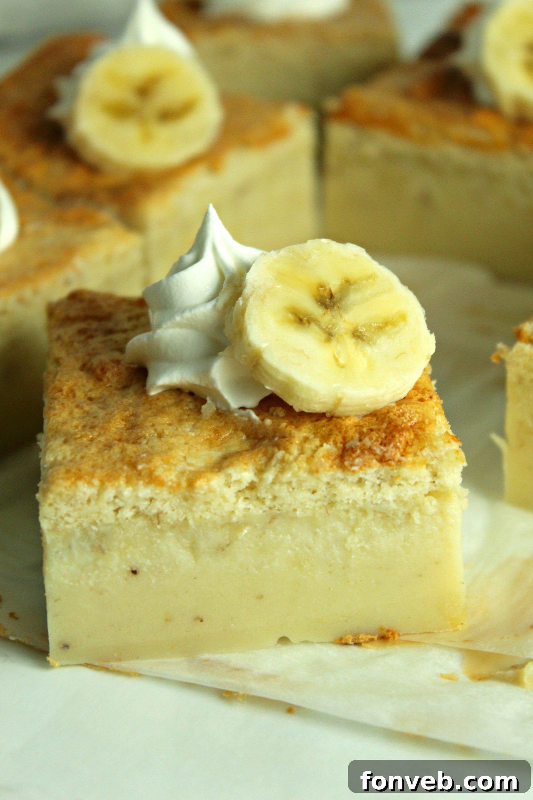 Banana Alchemy Cake 3 Closeup shot of Banana Magic Cake layers, highlighting the creamy middle and sponge top.