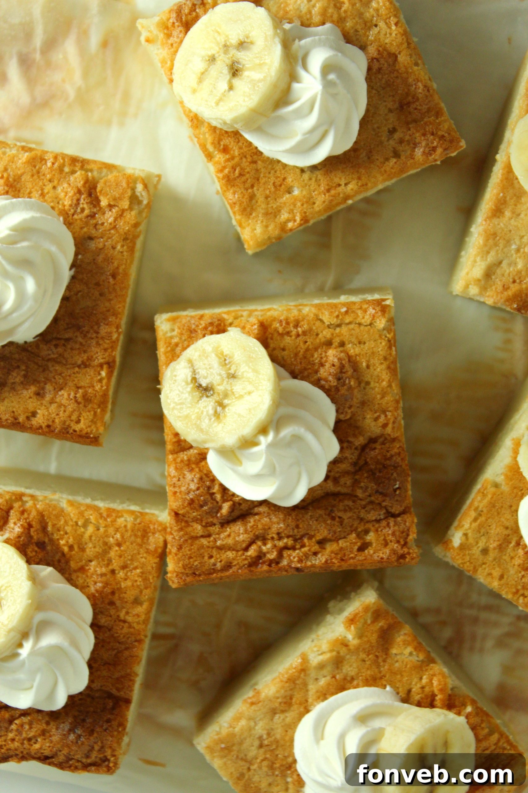Banana Alchemy Cake 8 Banana Magic Cake slices artfully arranged on a rustic wooden board.