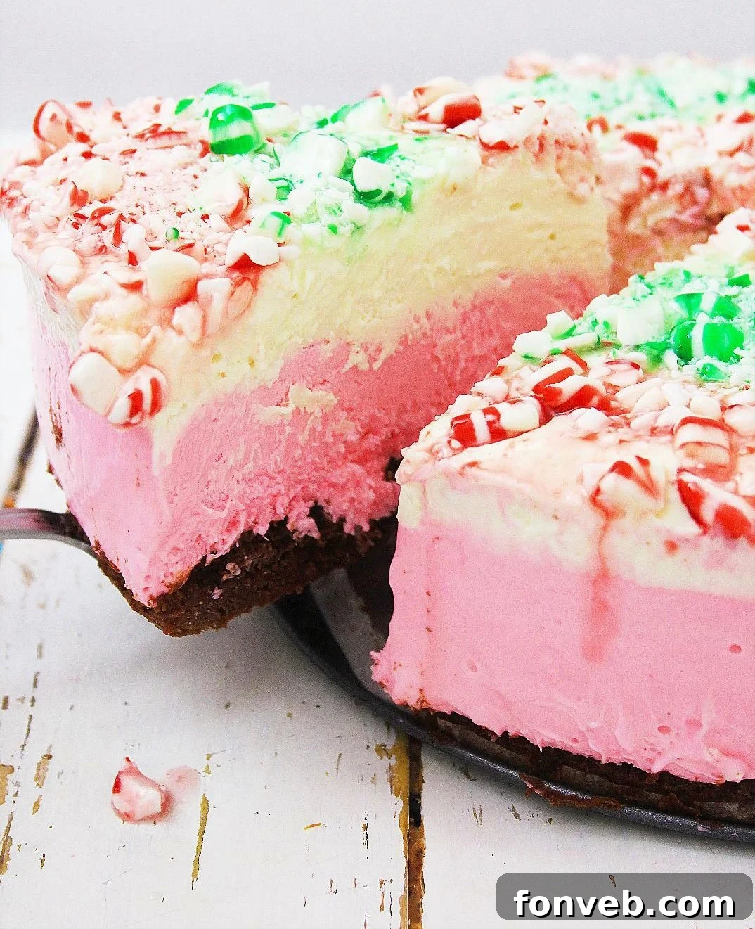 Delicious no-bake peppermint cheesecake with colorful layers