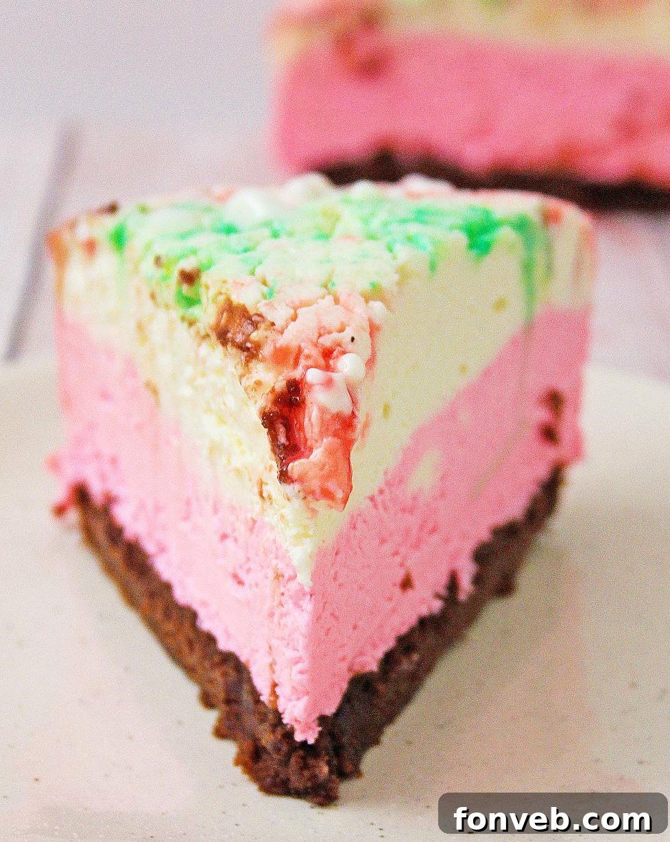Side view of the no-bake peppermint cheesecake showing layers and crust