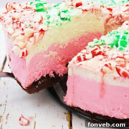 No Bake Holiday Cheesecake with brownie crust and mint topping