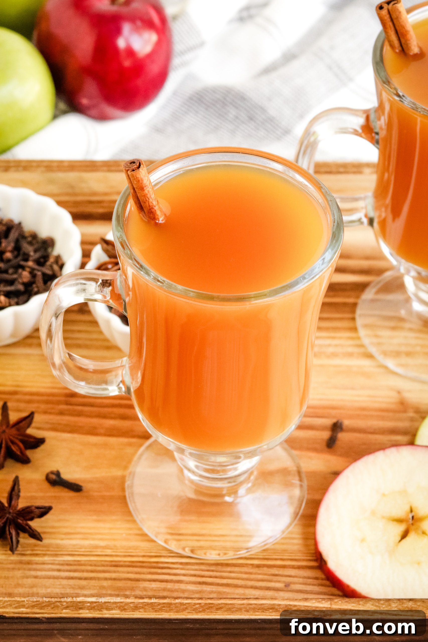 Cozy Slow Cooker Spiced Cider 2 Hot Mulled Apple Cider simmering in a pot with sliced oranges and apples, ready to serve.