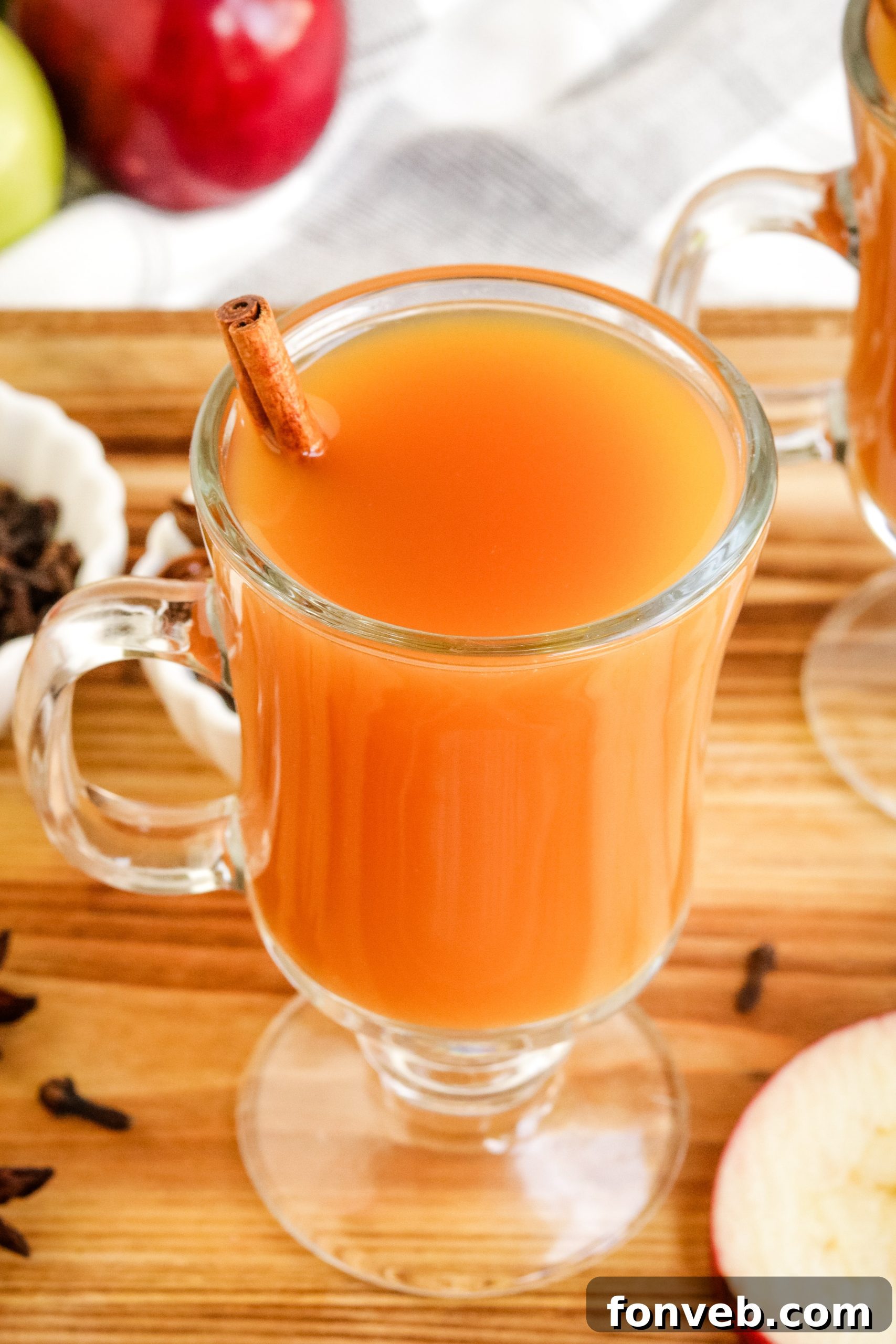 Cozy Slow Cooker Spiced Cider 6 A slow cooker filled with hot mulled cider, with a ladle resting beside it, perfect for a party.